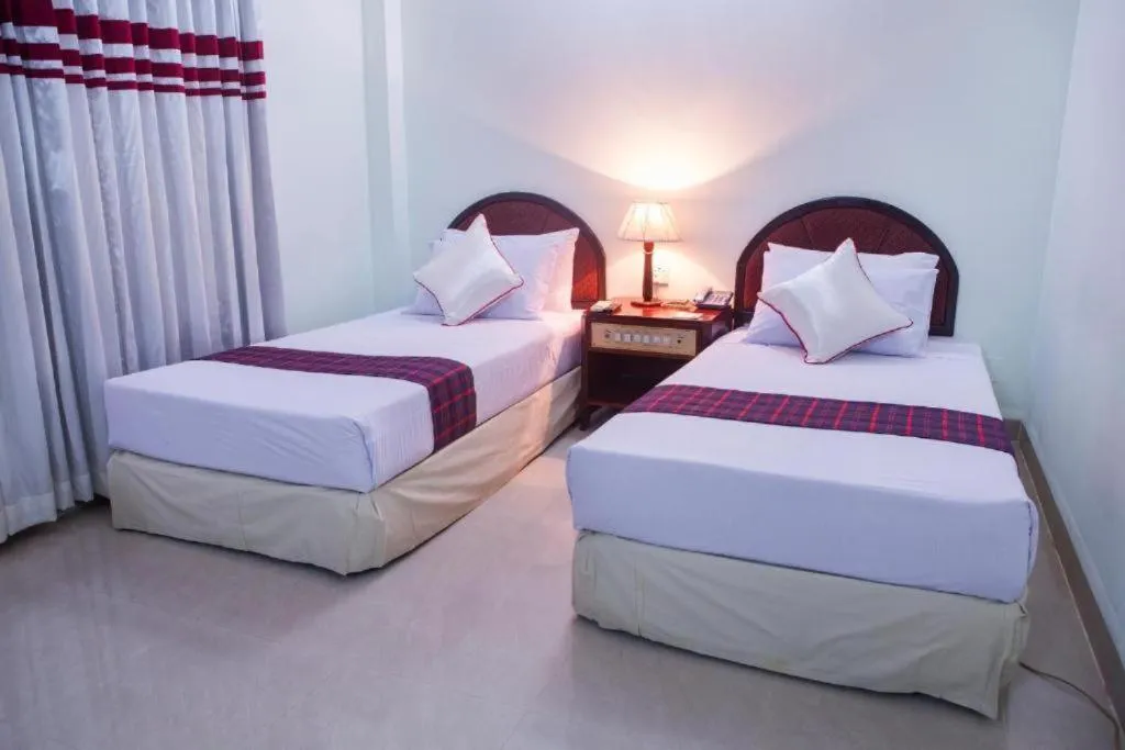 Bed in Meridian Hotel & Restaurant