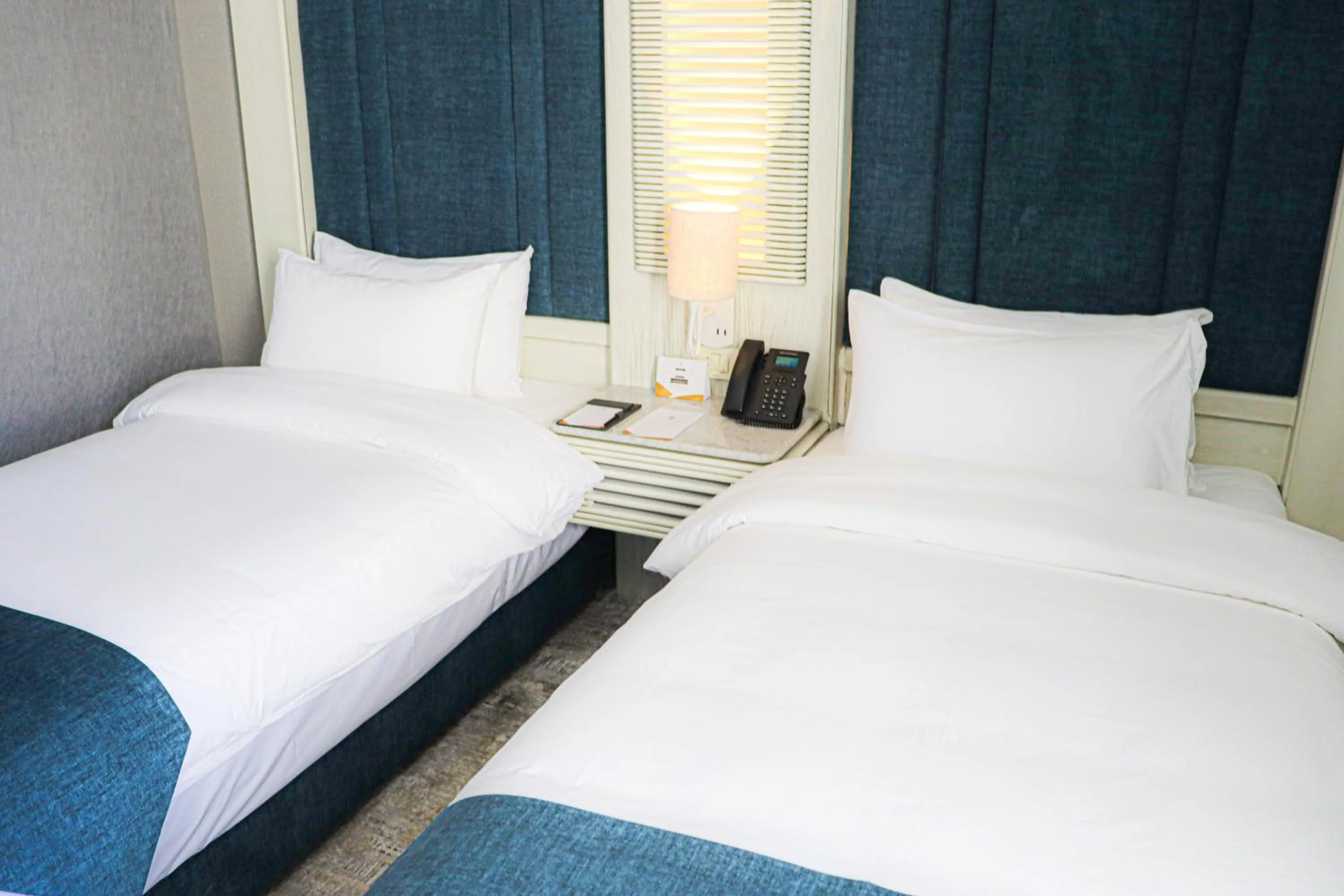 Bed in Rival Hotel Amman