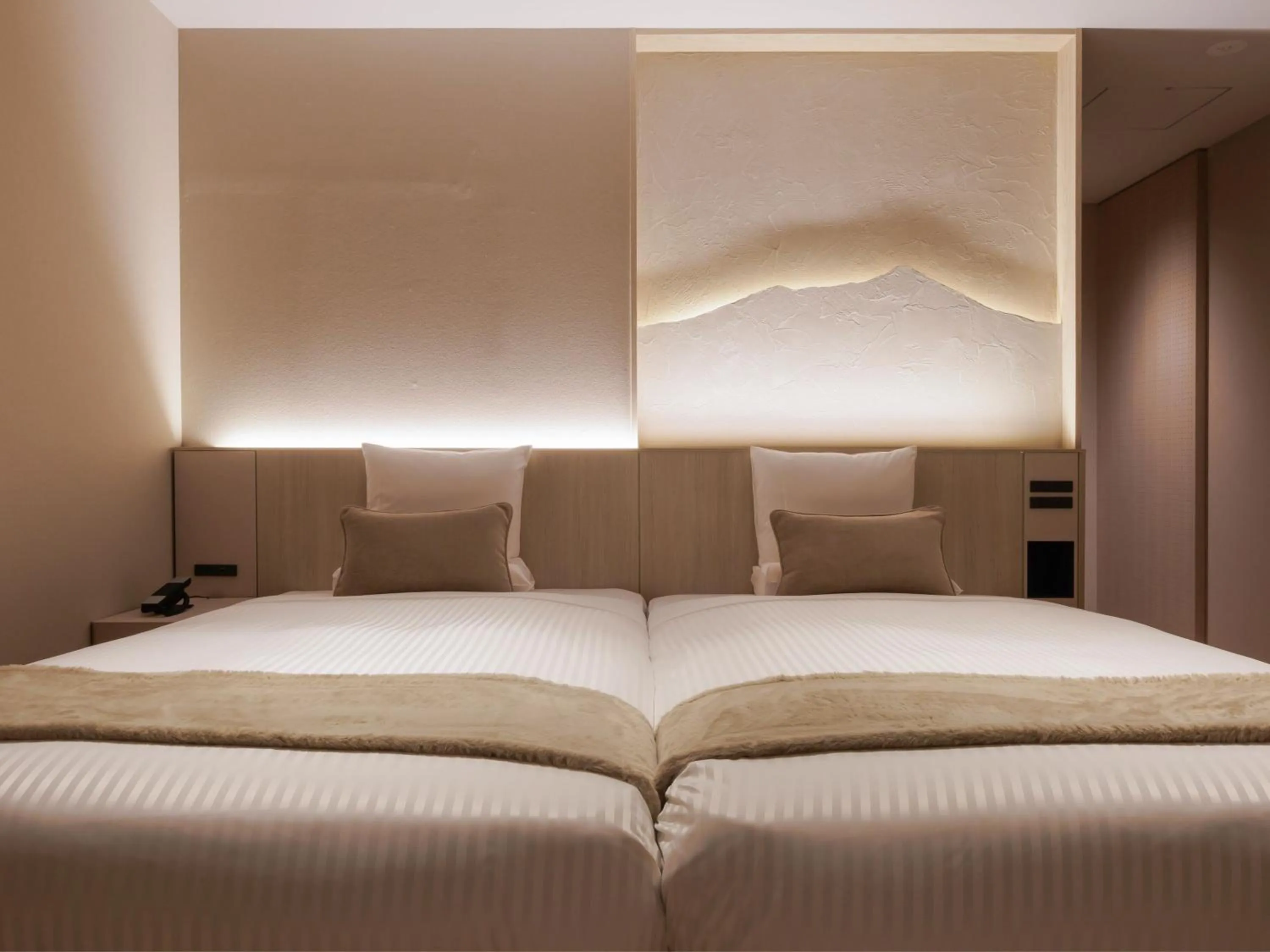 Bed in Kamenoi Hotel Tsukubasan