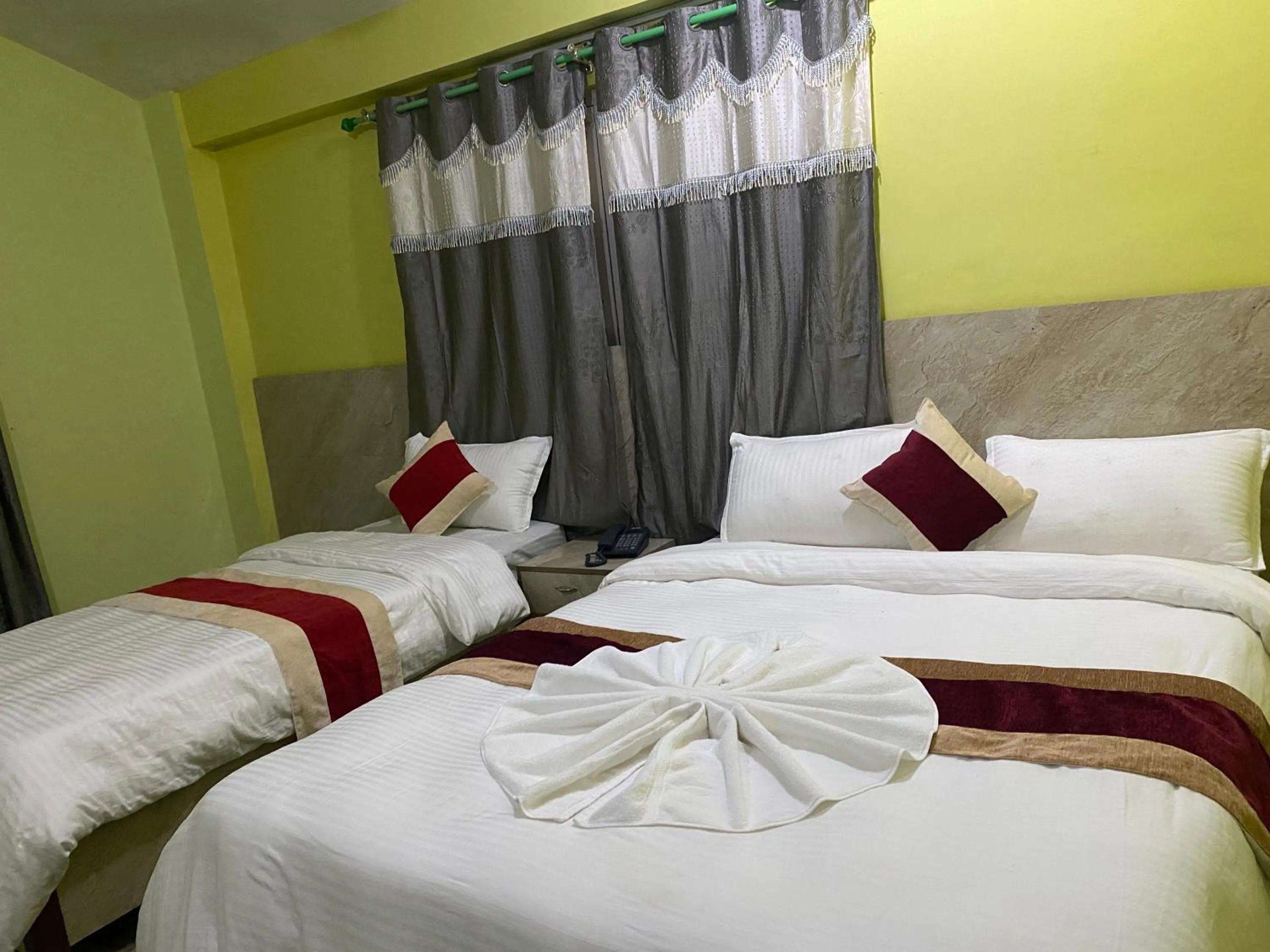 Bed in Hotel Kavya Inn