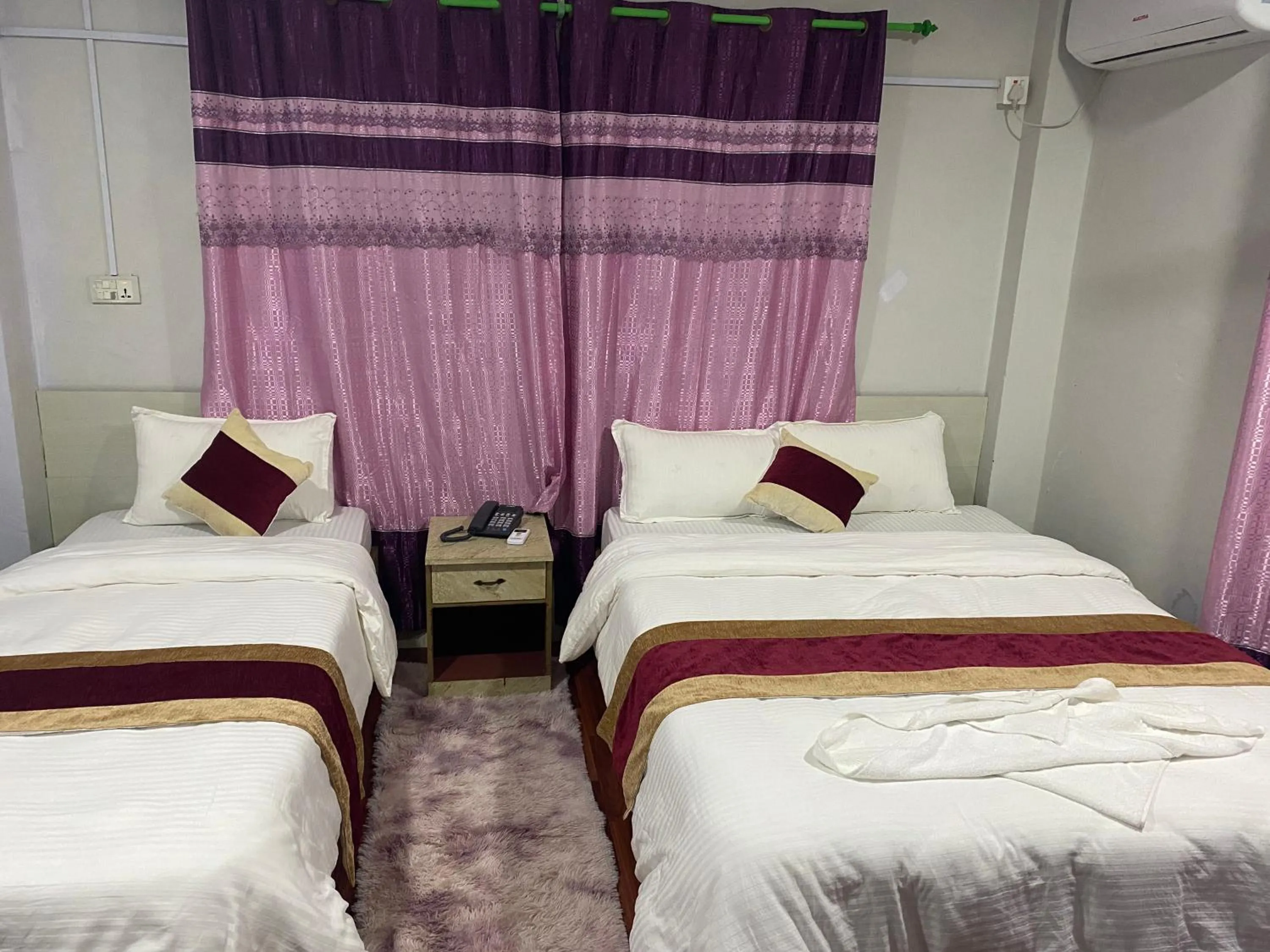 Bed in Hotel Kavya Inn
