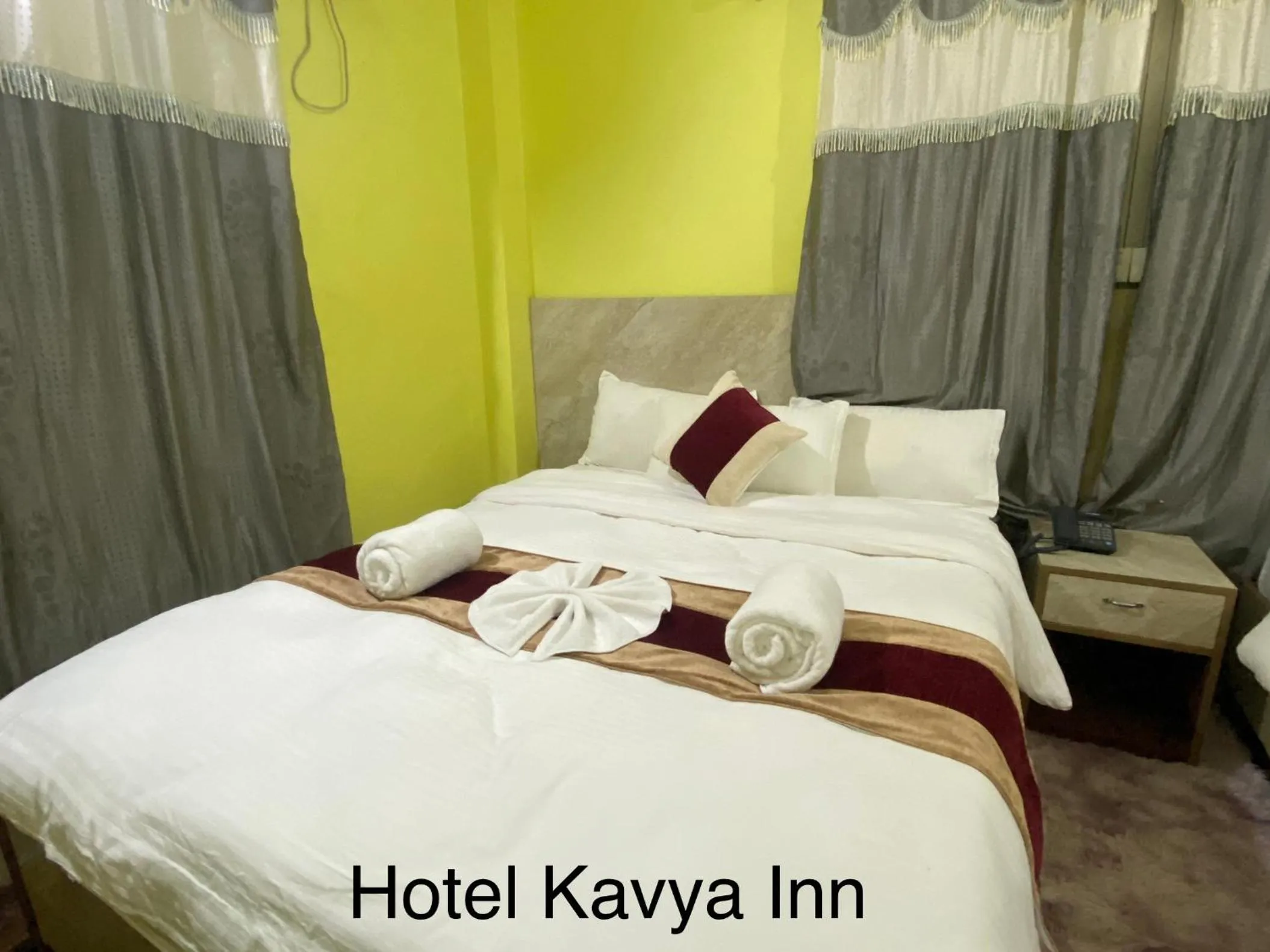 Bed in Hotel Kavya Inn