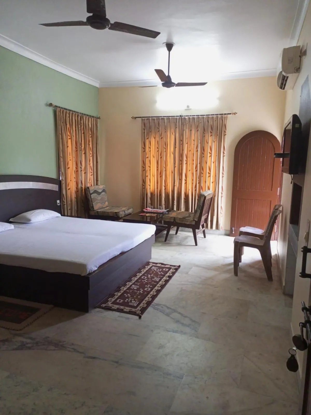 Photo of the whole room, Bed in MADHUR RESIDENCY