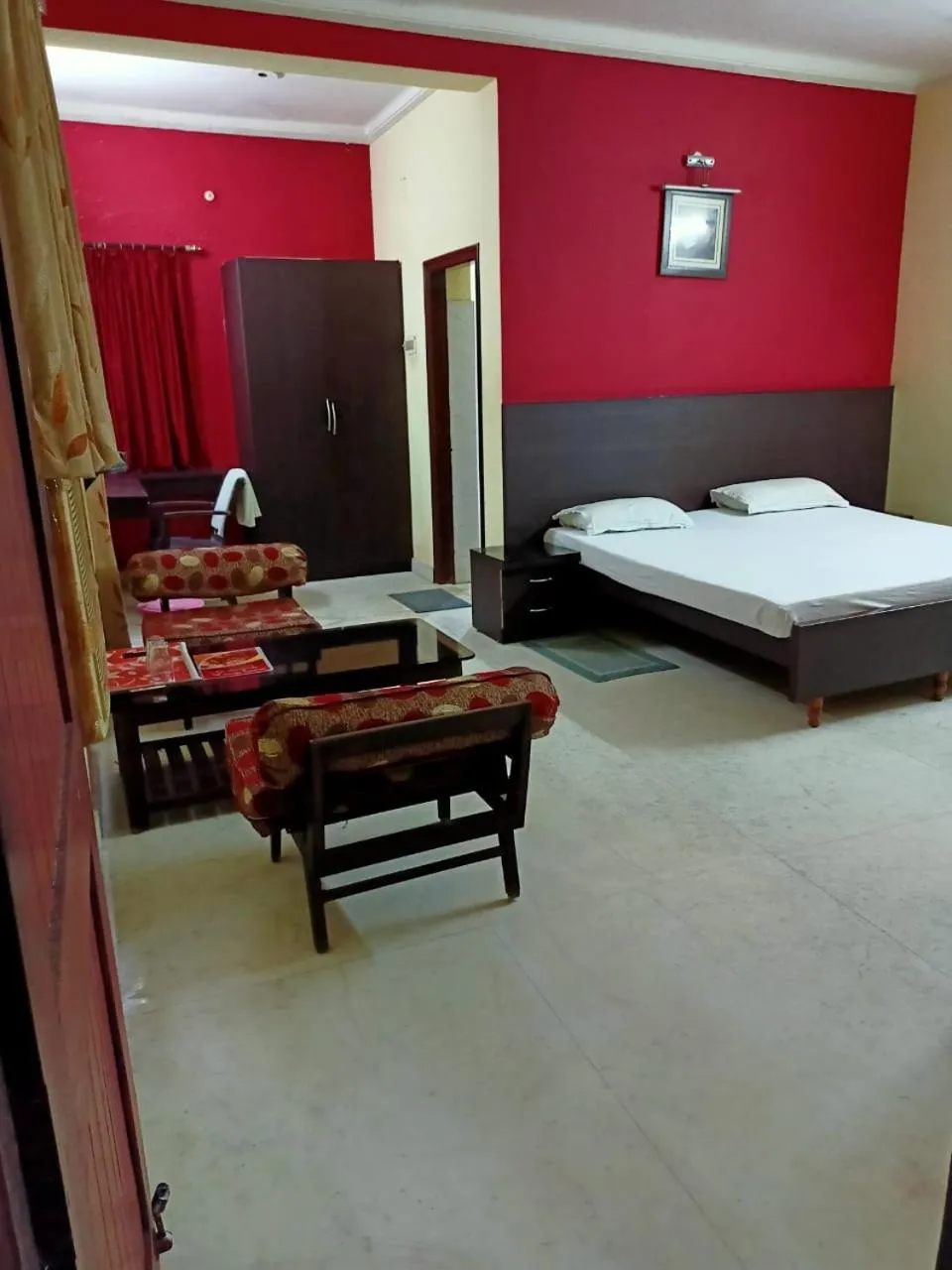 Photo of the whole room, Bed in MADHUR RESIDENCY