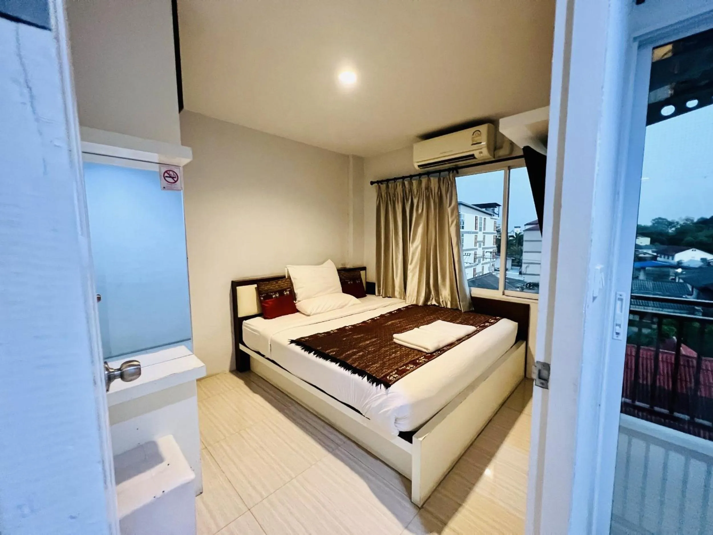 Photo of the whole room, Bed in INN Kham Apartment