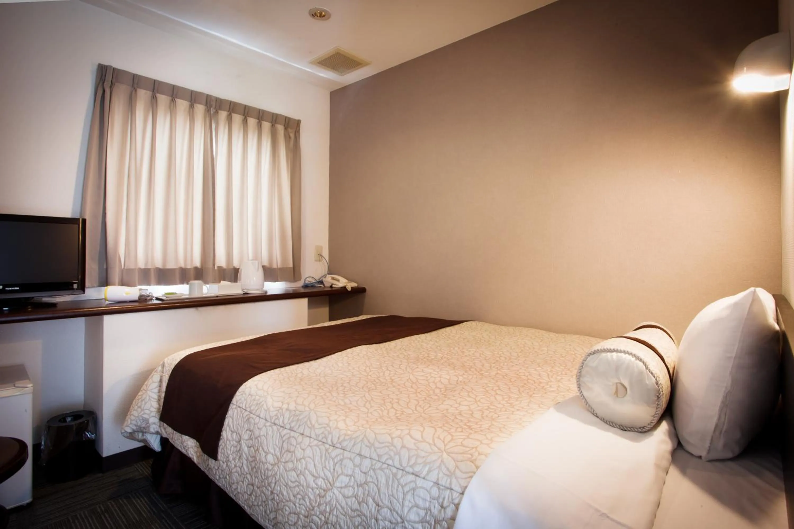 Bed in Kakegawa Station Hotel