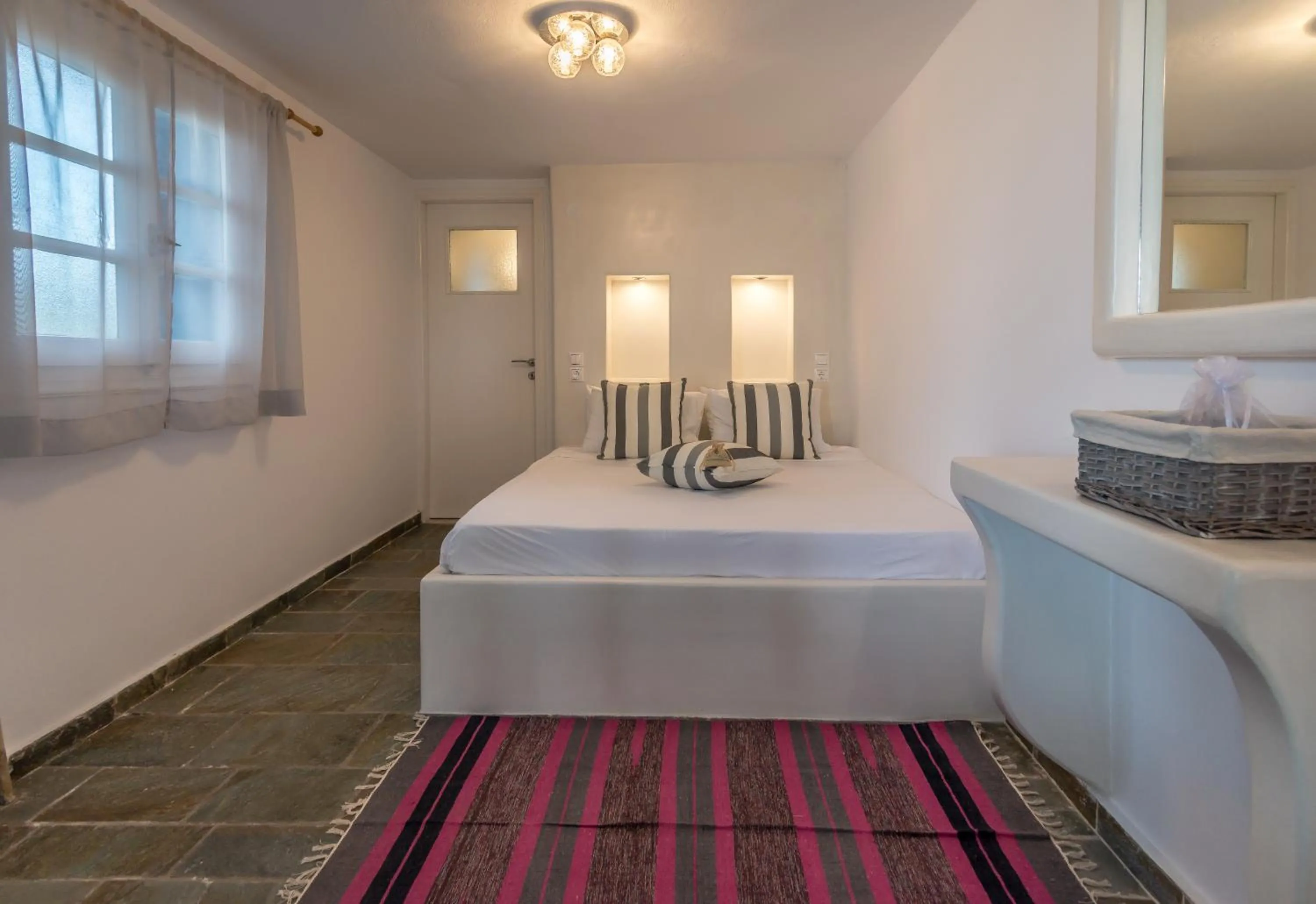 Bed in Eiriana Luxury Suites