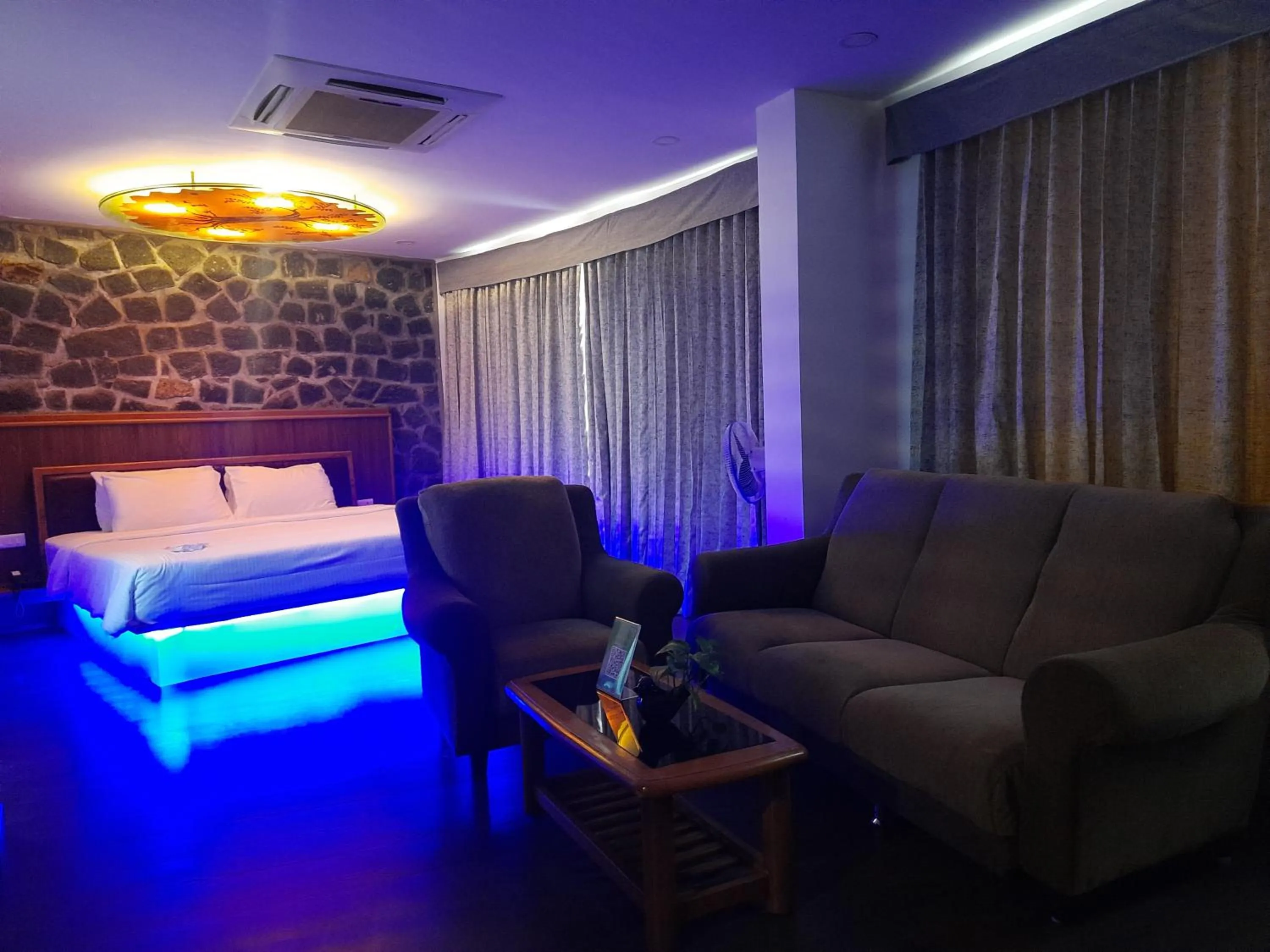Living room, Bed in GReaT Trails Yercaud by GRT Hotels
