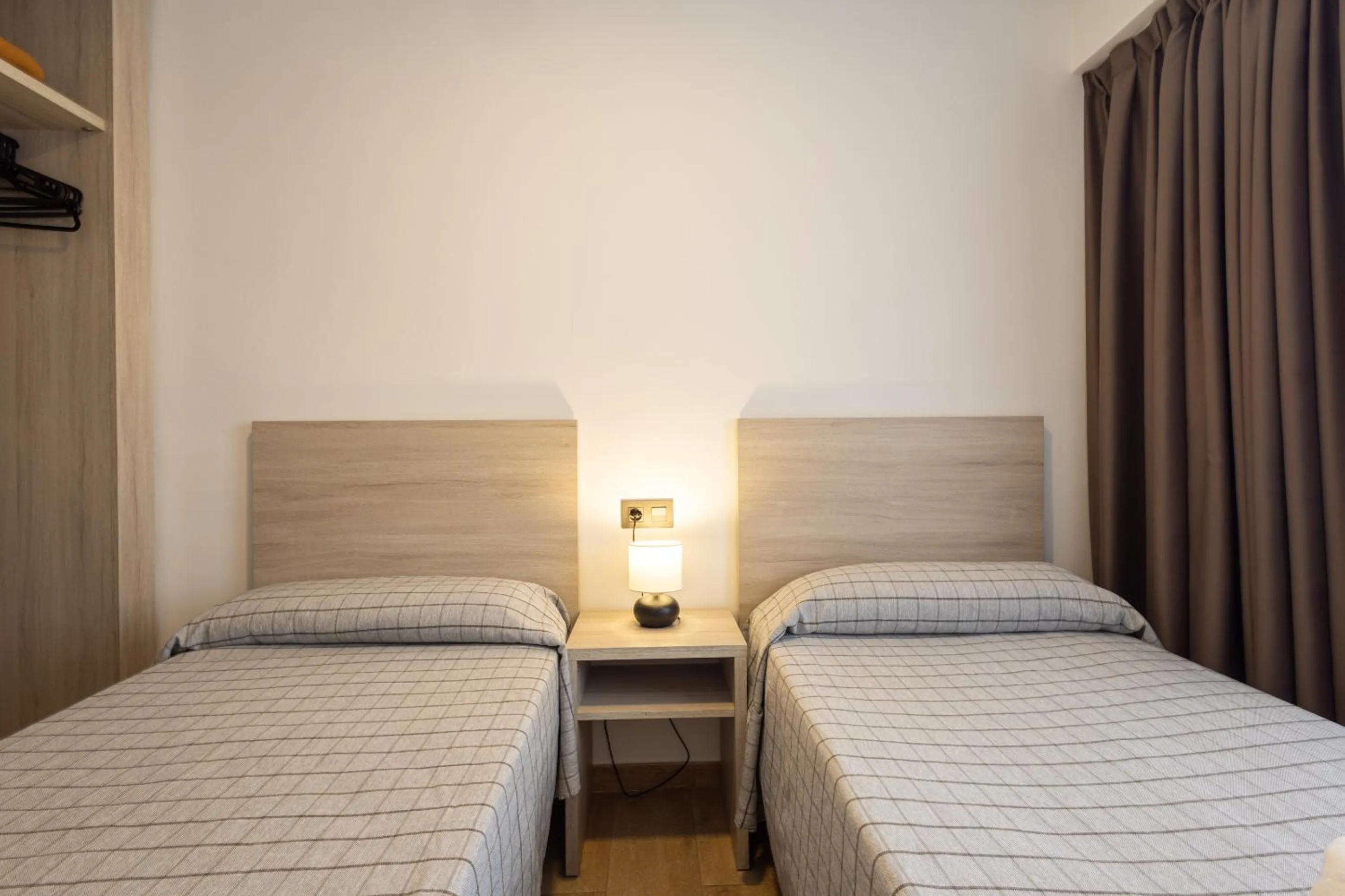 Bedroom, Bed in Apartamentos Odysea By Apartamentos Valentia