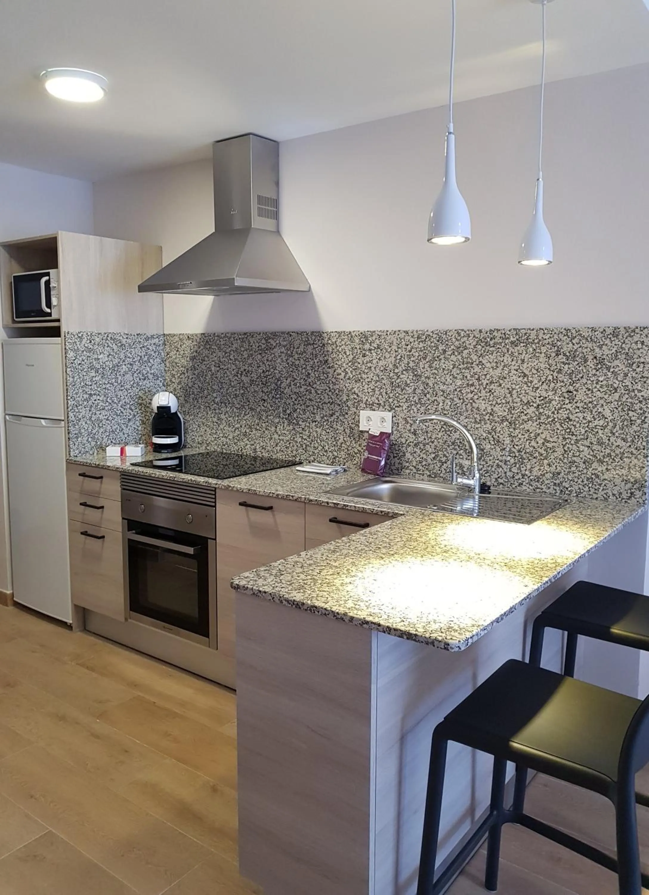 Kitchen or kitchenette in Apartamentos Odysea By Apartamentos Valentia