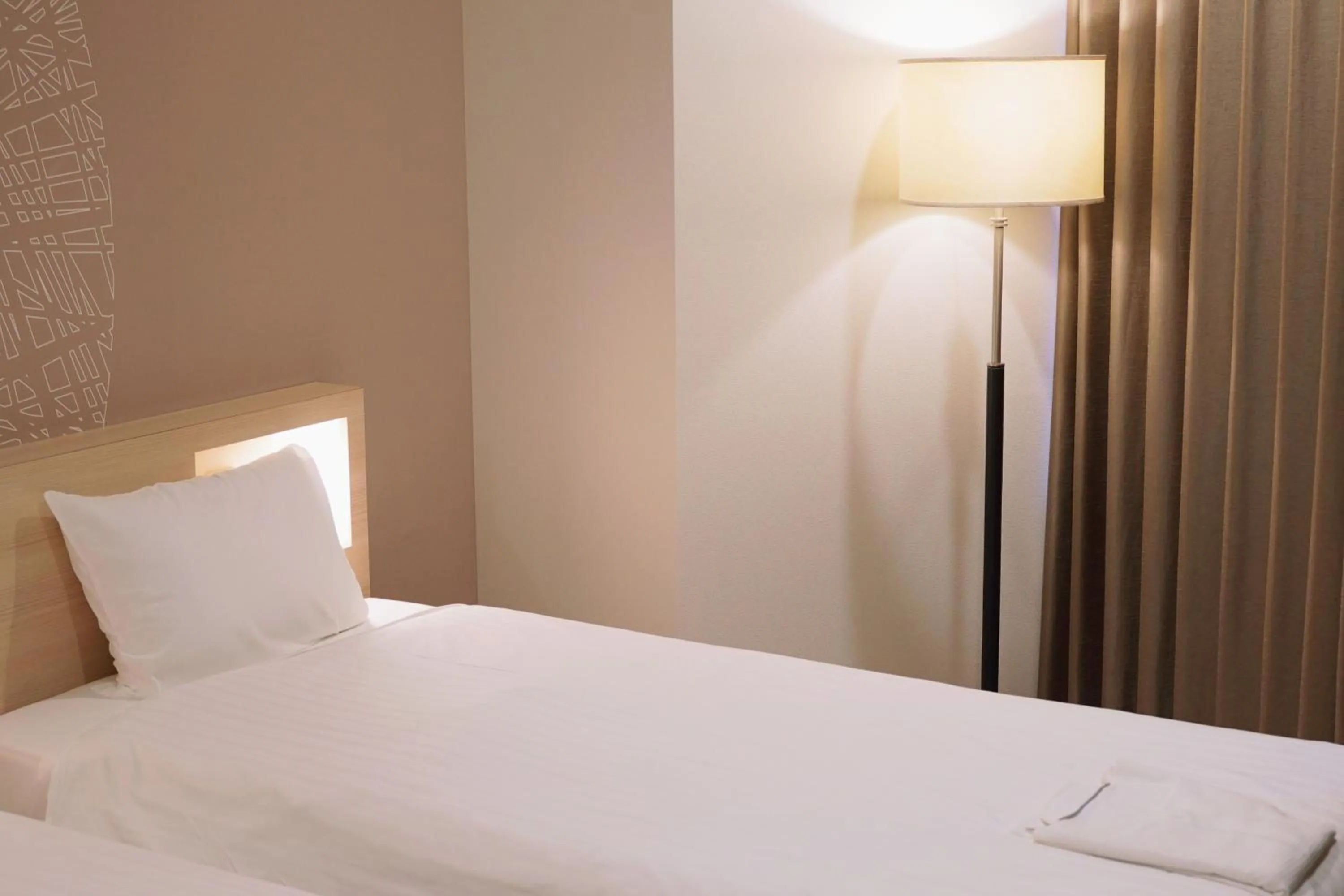 Bed in Park Central Sakura Hotel