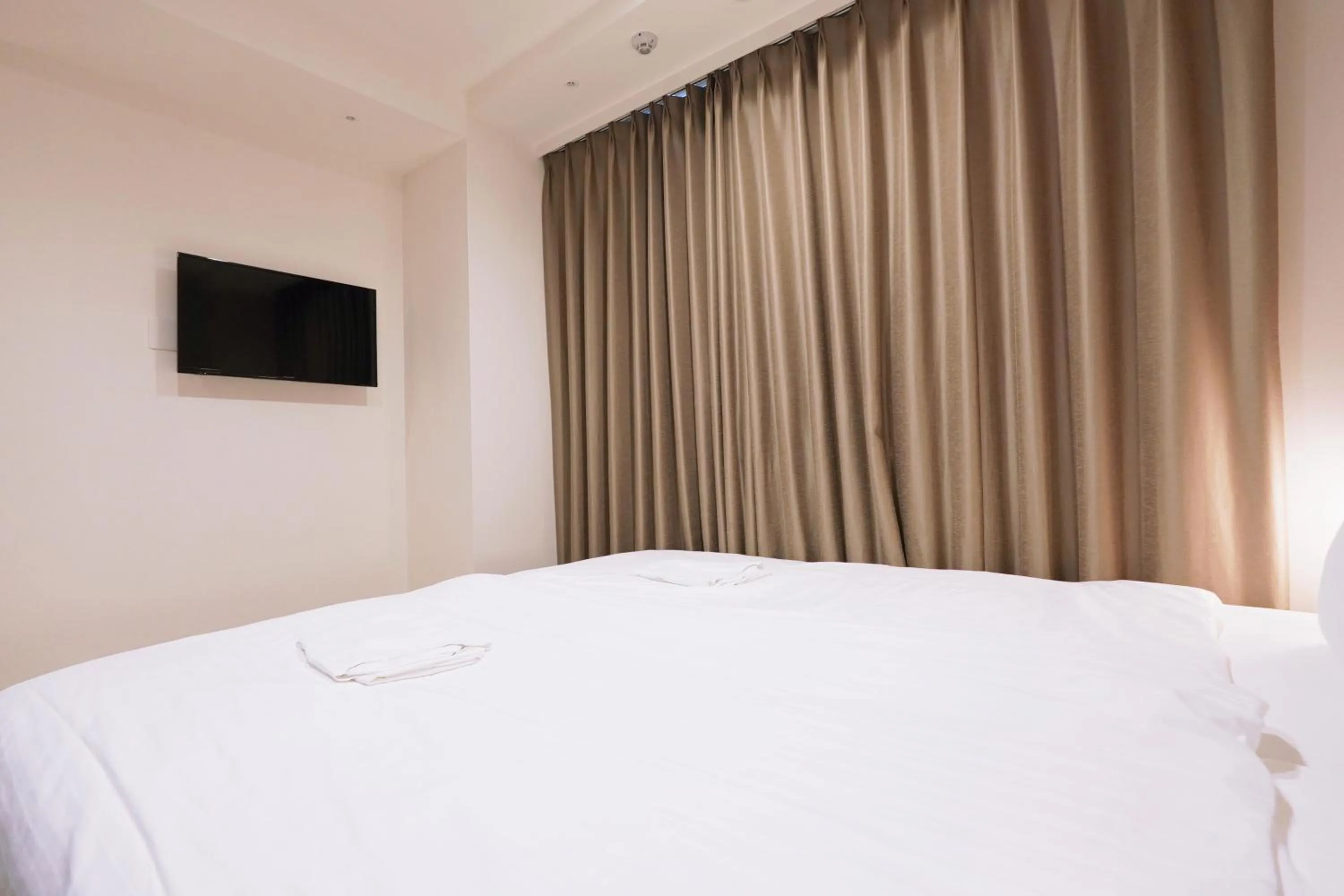 Bed in Park Central Sakura Hotel