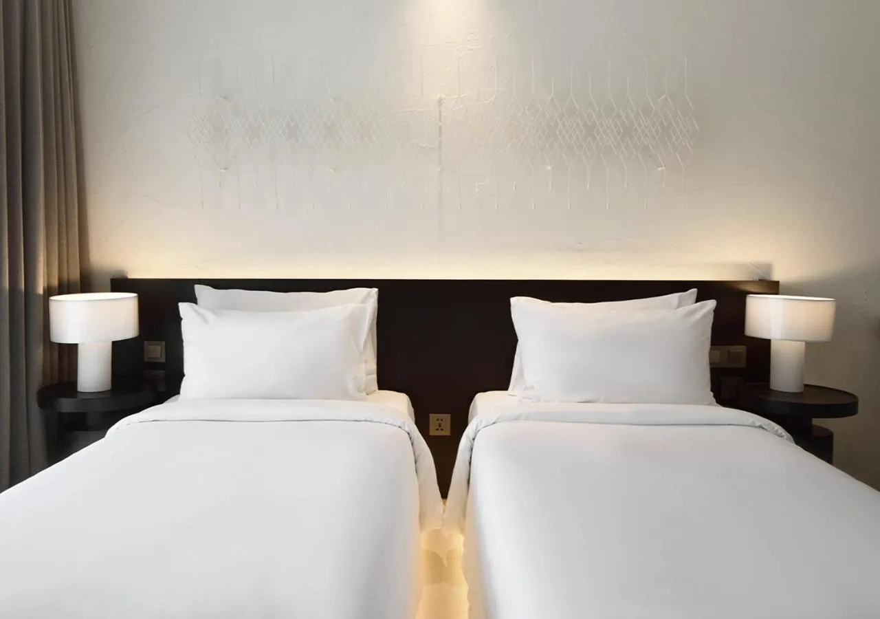 Bed in Arun Khiri Chiang Mai Hotel