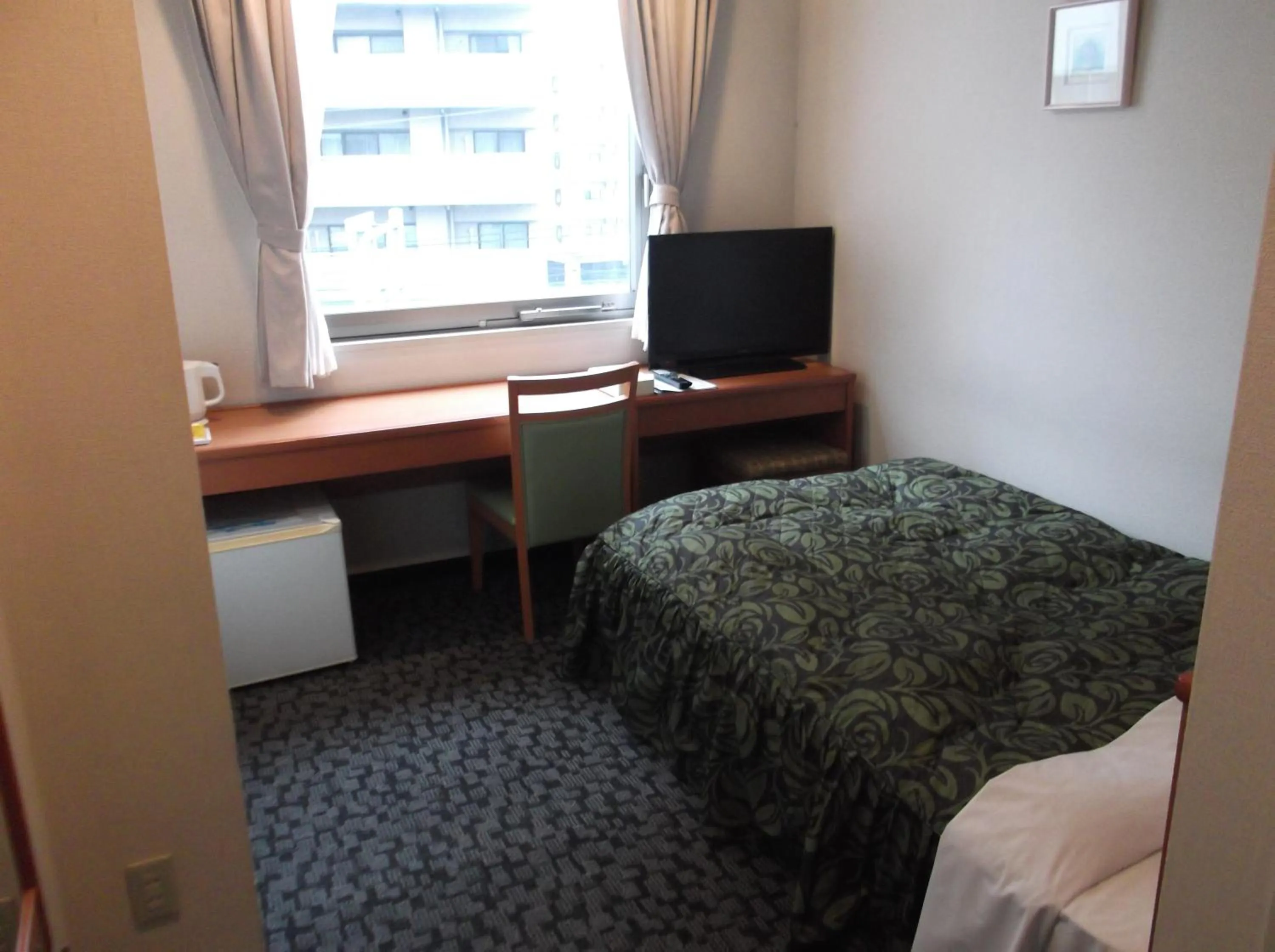 Bed in Hotel Sunrise21