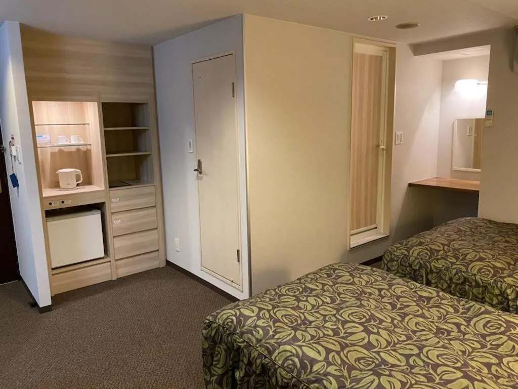 Bed in Hotel Sunrise21