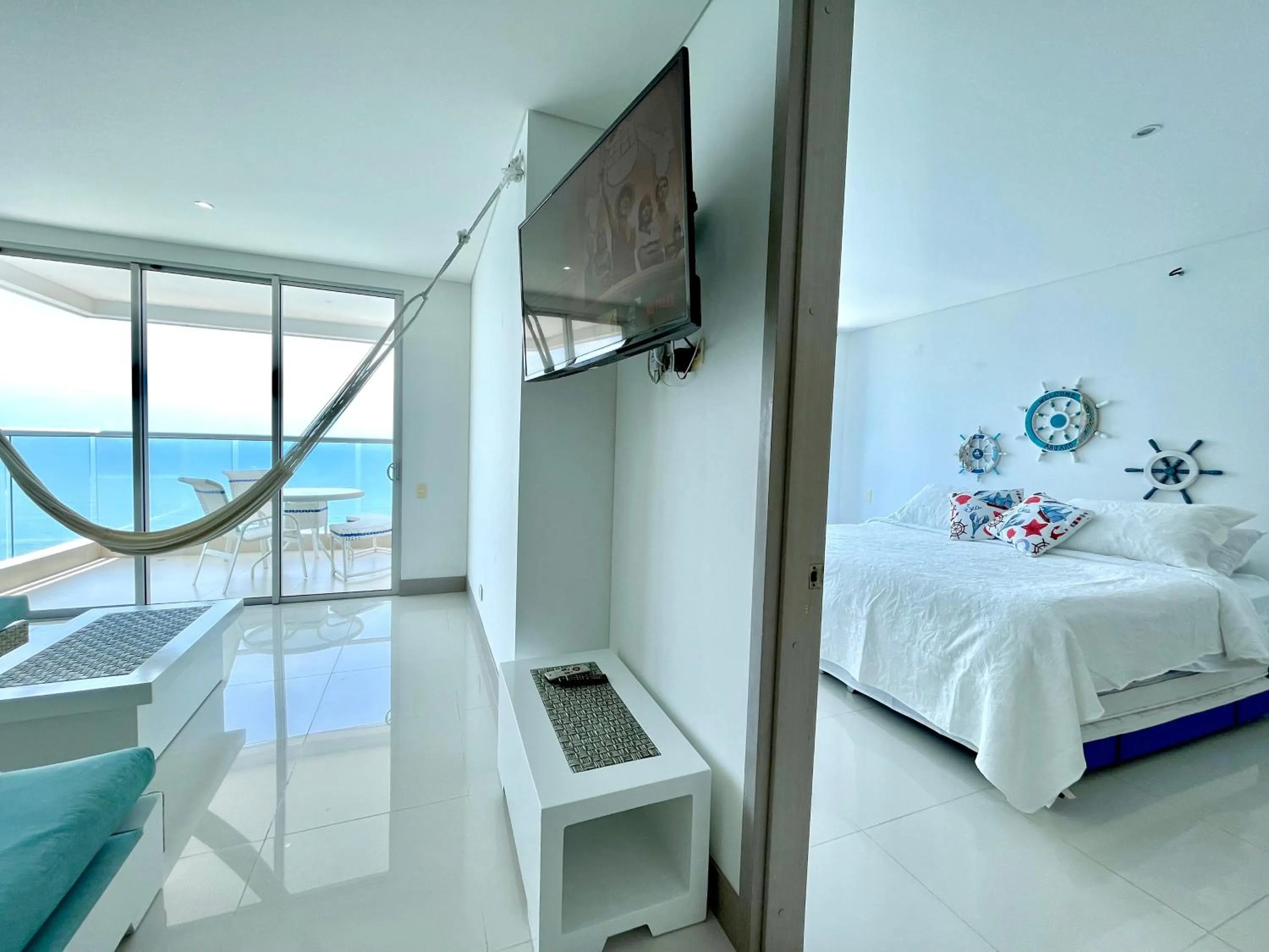 Communal lounge/ TV room, Bed in by Calamari Homes - Palmetto Beach 2504 Bocagrande
