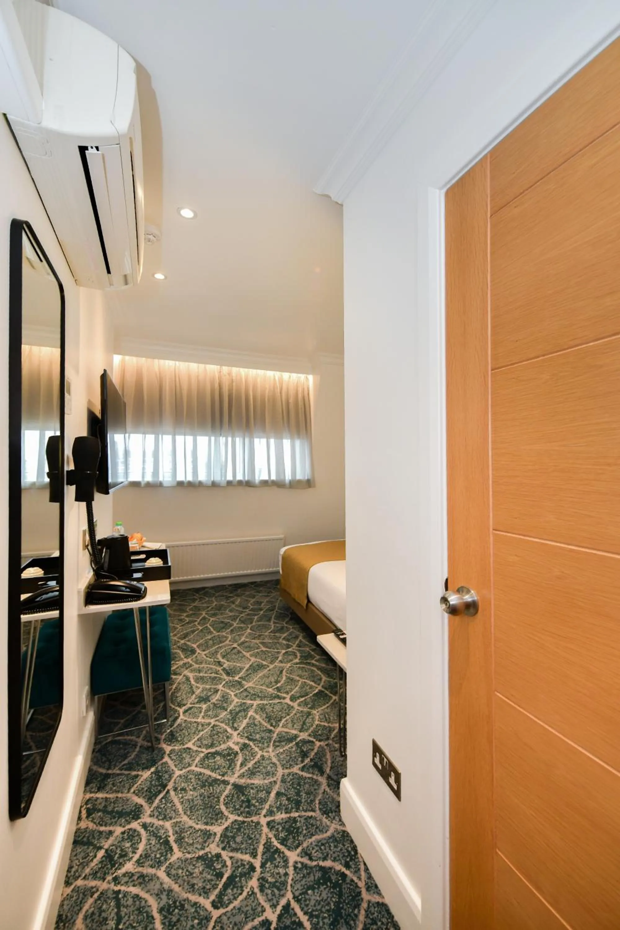 Bedroom in Queens Park Premier London Hyde Park