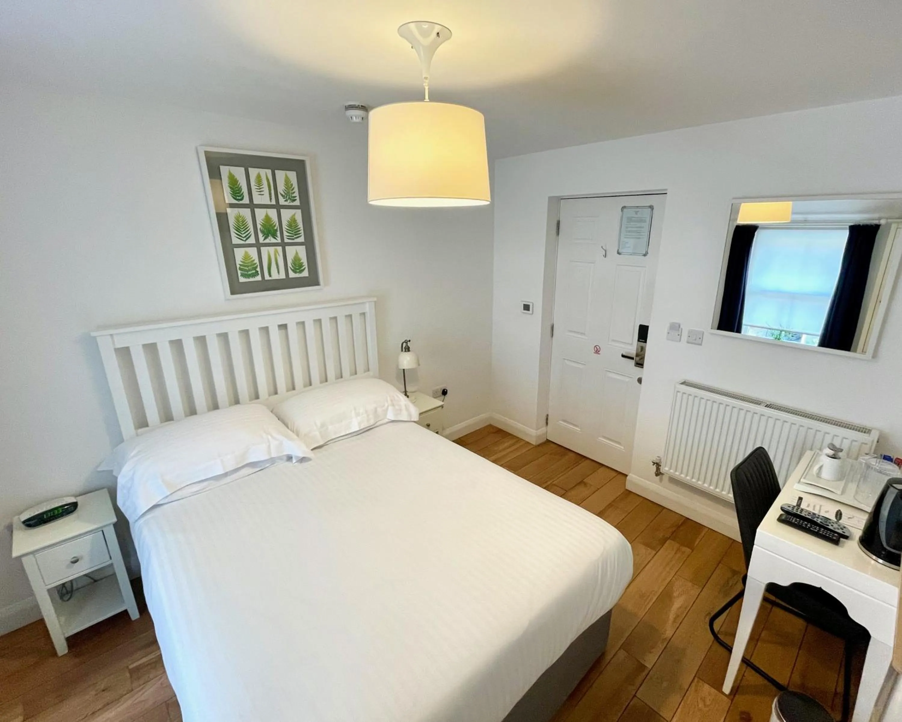 Bed in The Queen's Head Hotel