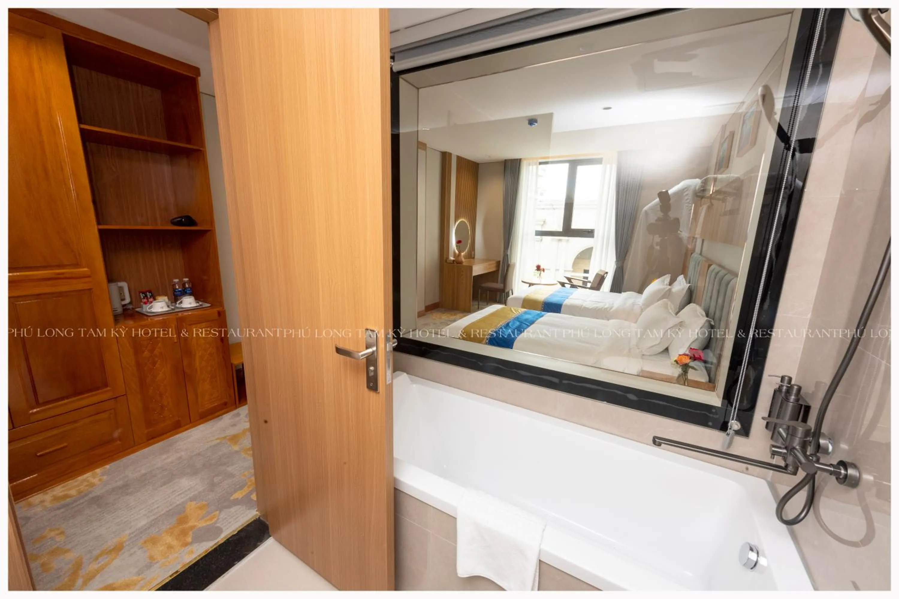 Shower, Bed in Phú Long Tam Kỳ Hotel & Restaurant