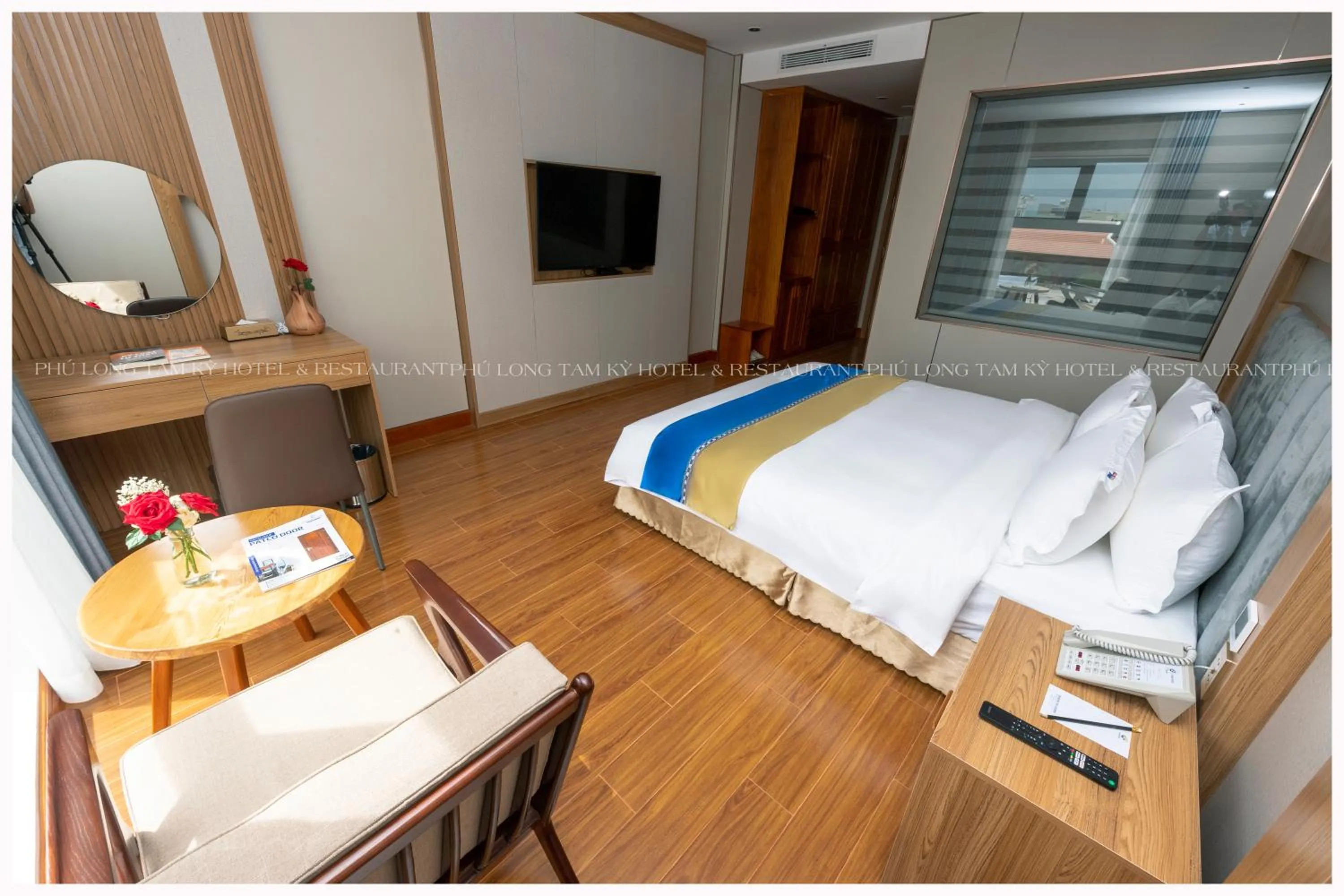 Photo of the whole room, Bed in Phú Long Tam Kỳ Hotel & Restaurant