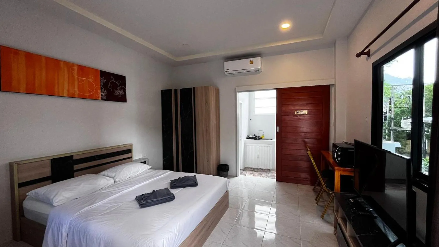 Bed in M&N Guesthouse Kata