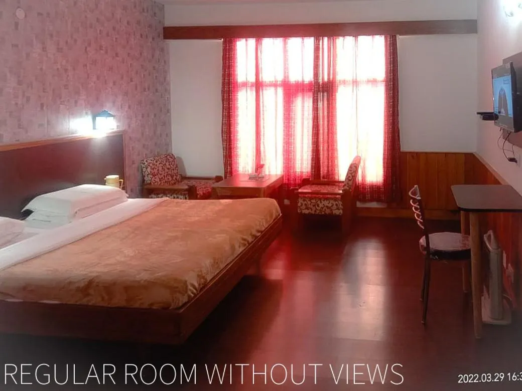 Bedroom, Bed in Vardaan Hotels - PatniTop