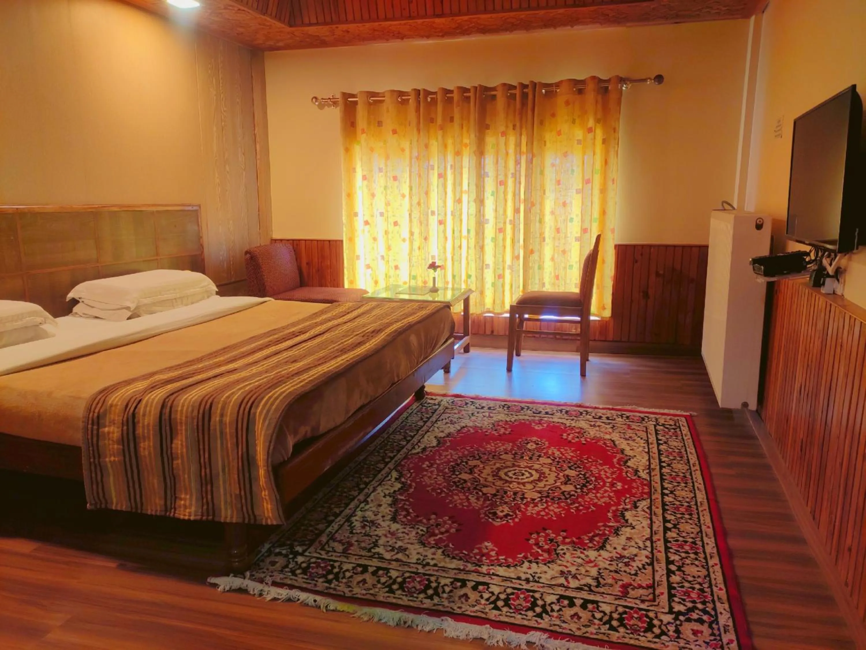 Bed in Vardaan Hotels - PatniTop