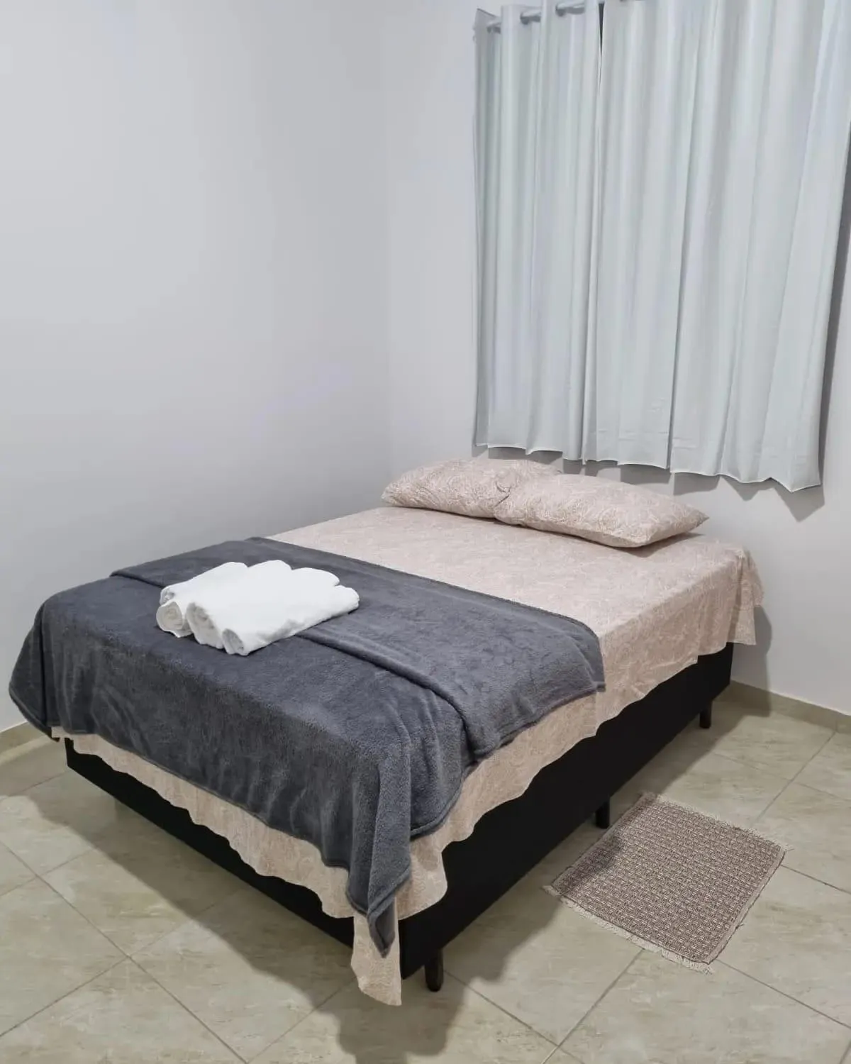 Bed in Pousada Talismã