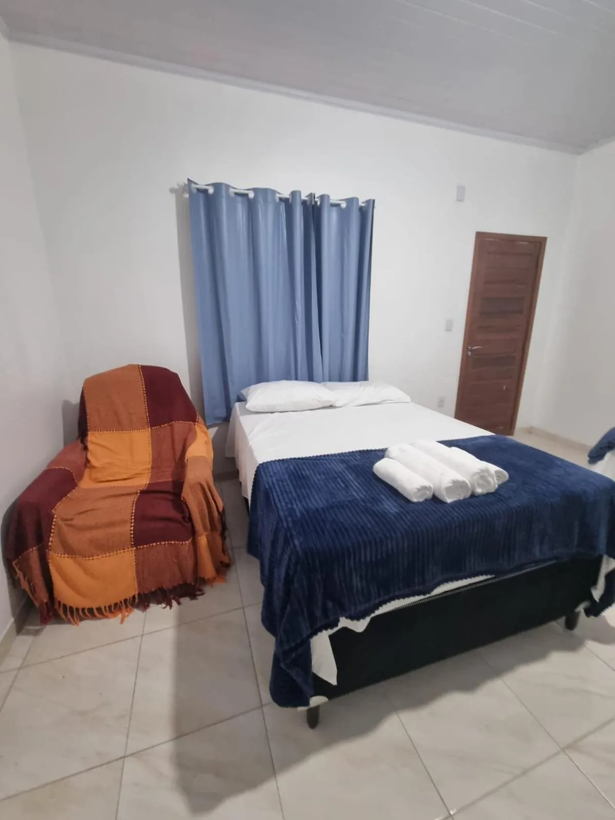 Bed in Pousada Talismã