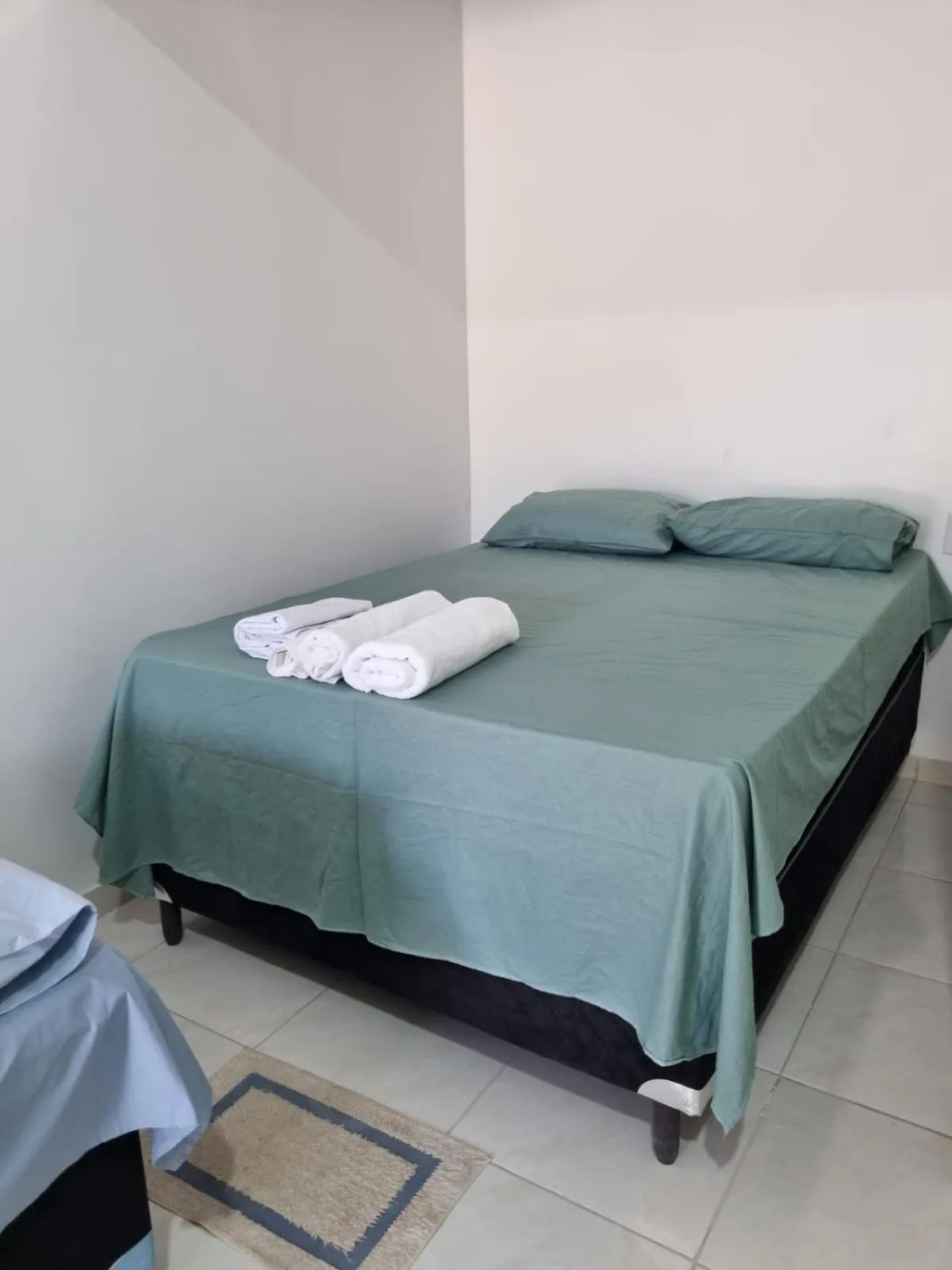 Bed in Pousada Talismã