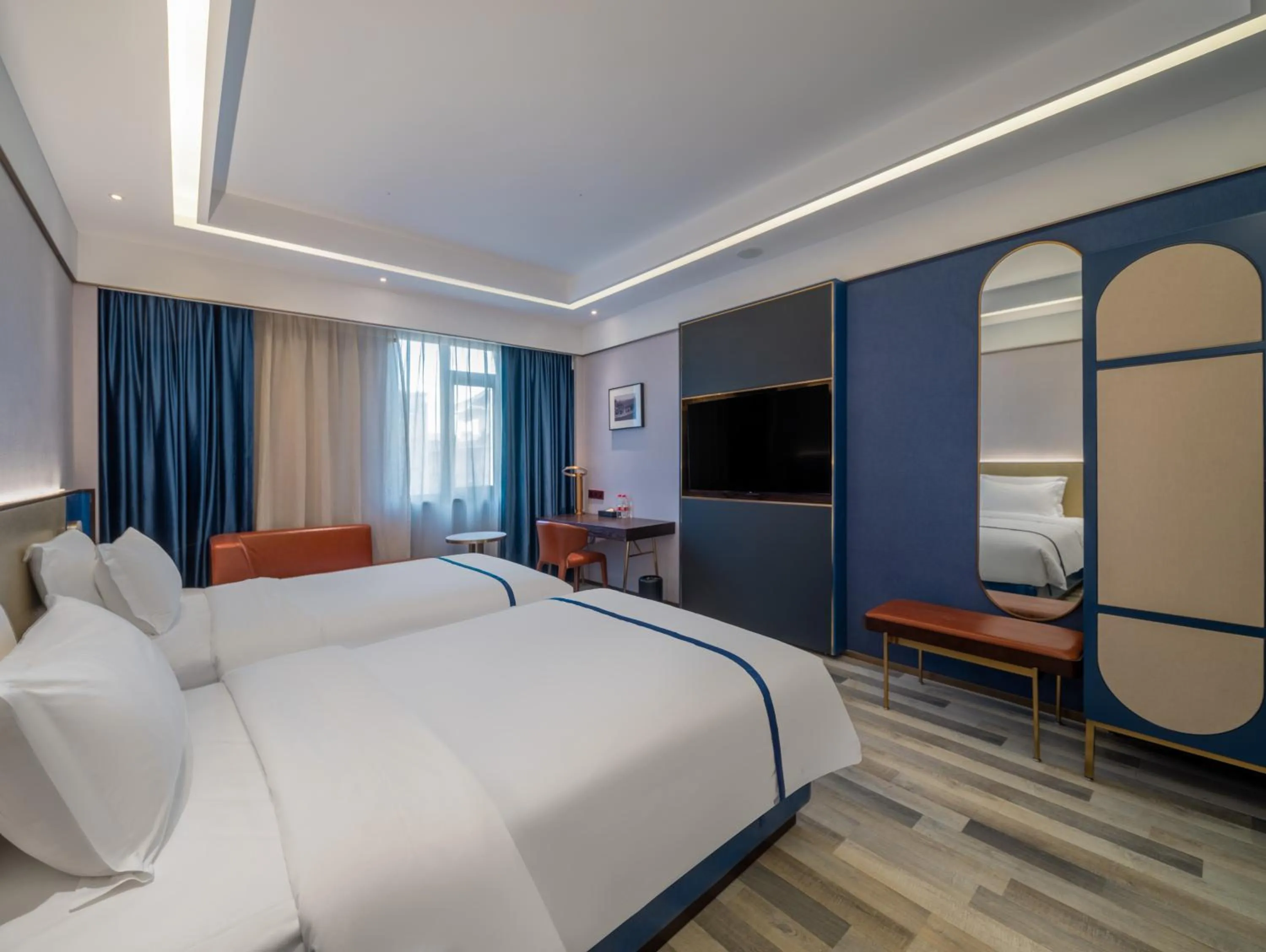 Communal lounge/ TV room, Bed in 西安钟楼枫渡酒店永兴坊地铁站店