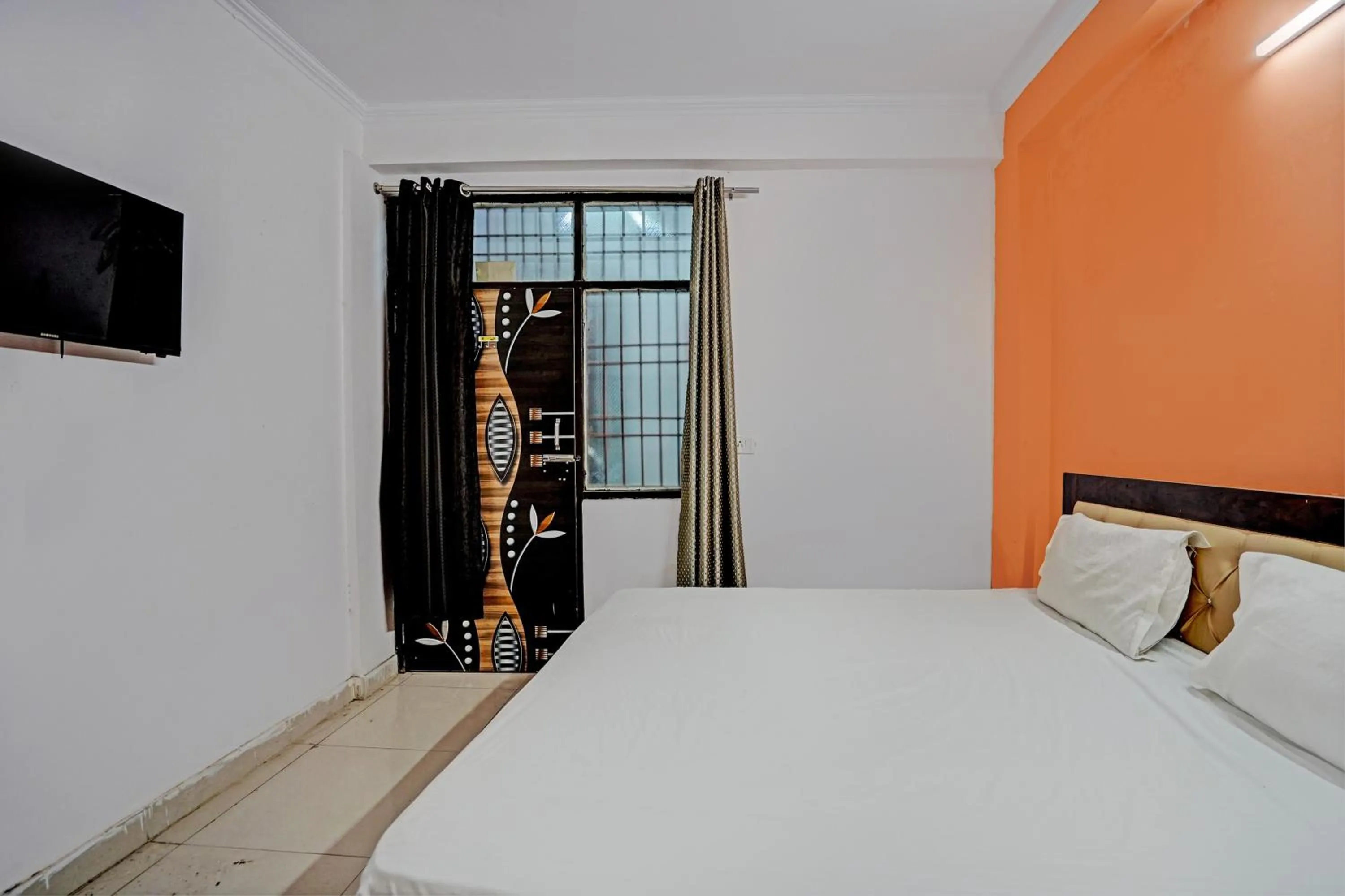 Bedroom in Hotel O Krishna Residency