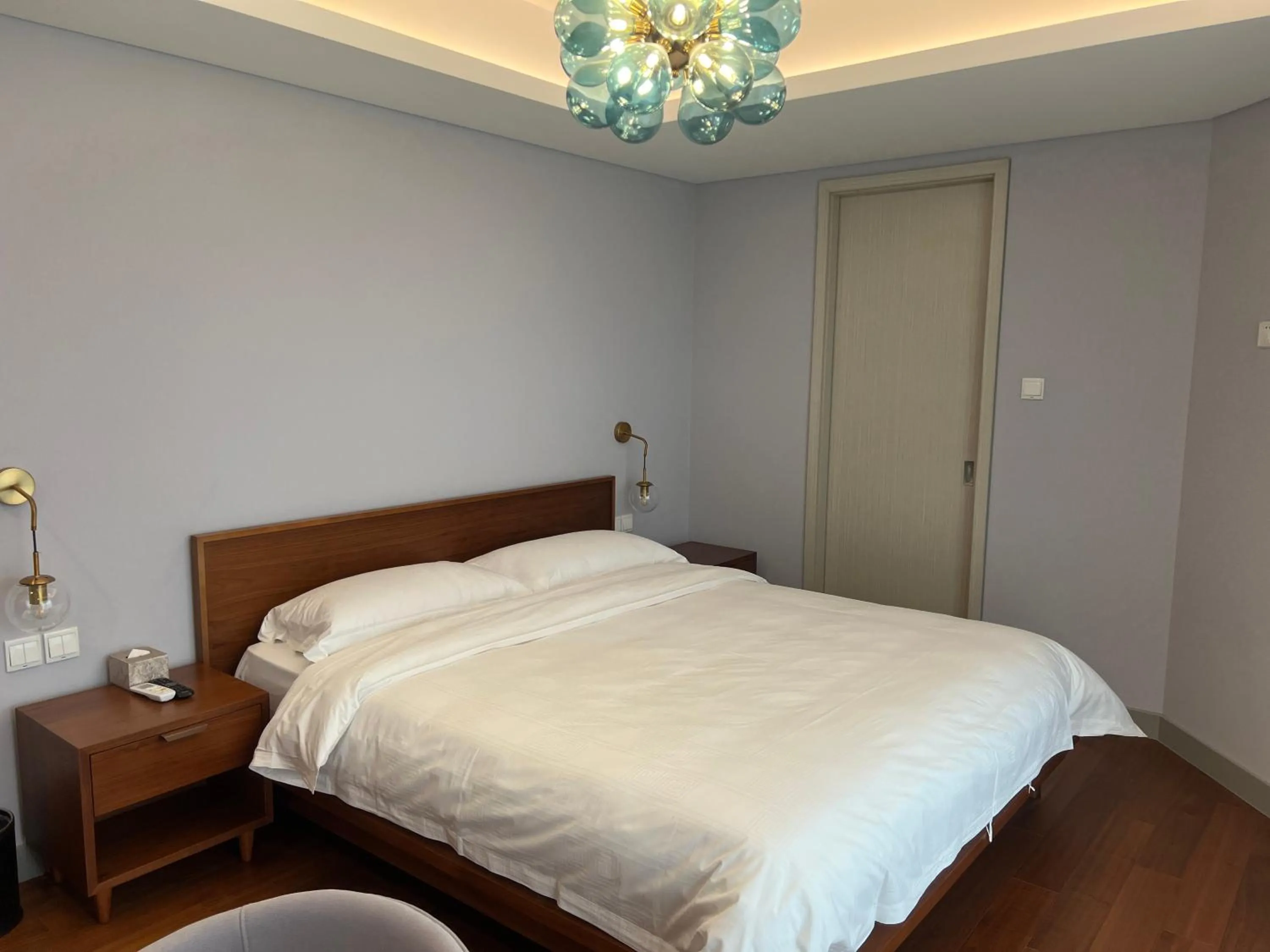 Bed in Guangyao Service Apartment Beijing Ritan