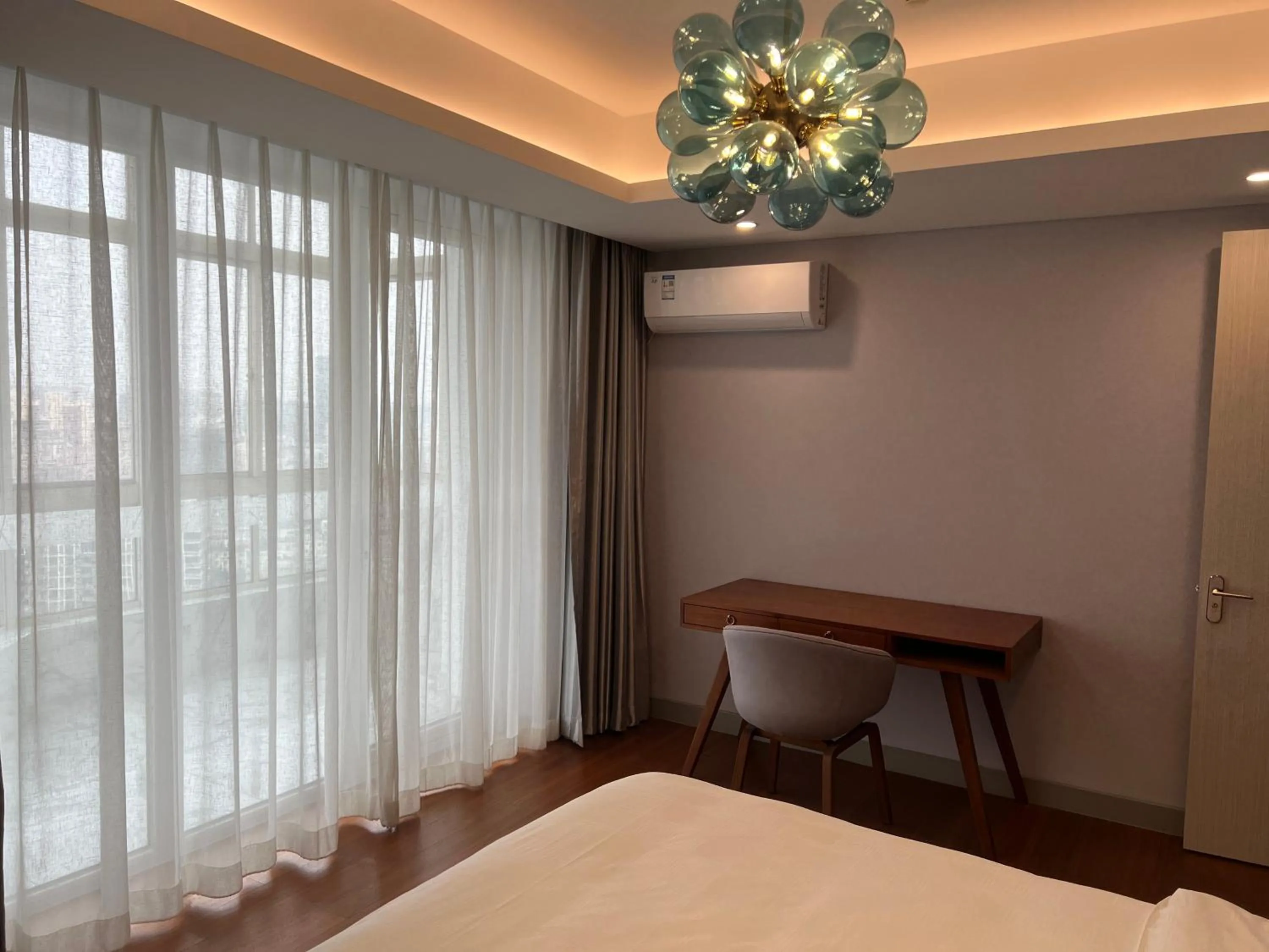 Bed in Guangyao Service Apartment Beijing Ritan