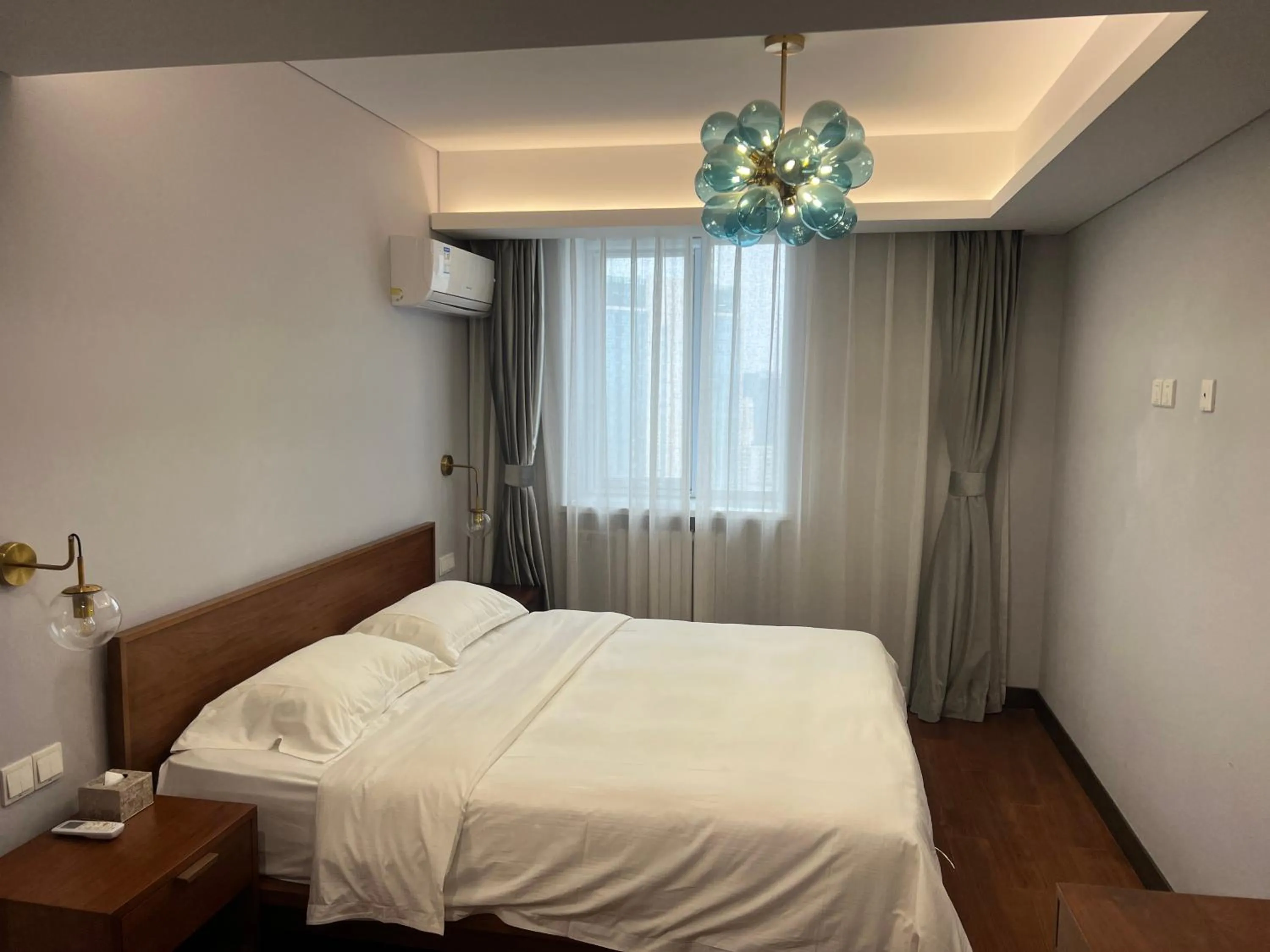 Bed in Guangyao Service Apartment Beijing Ritan