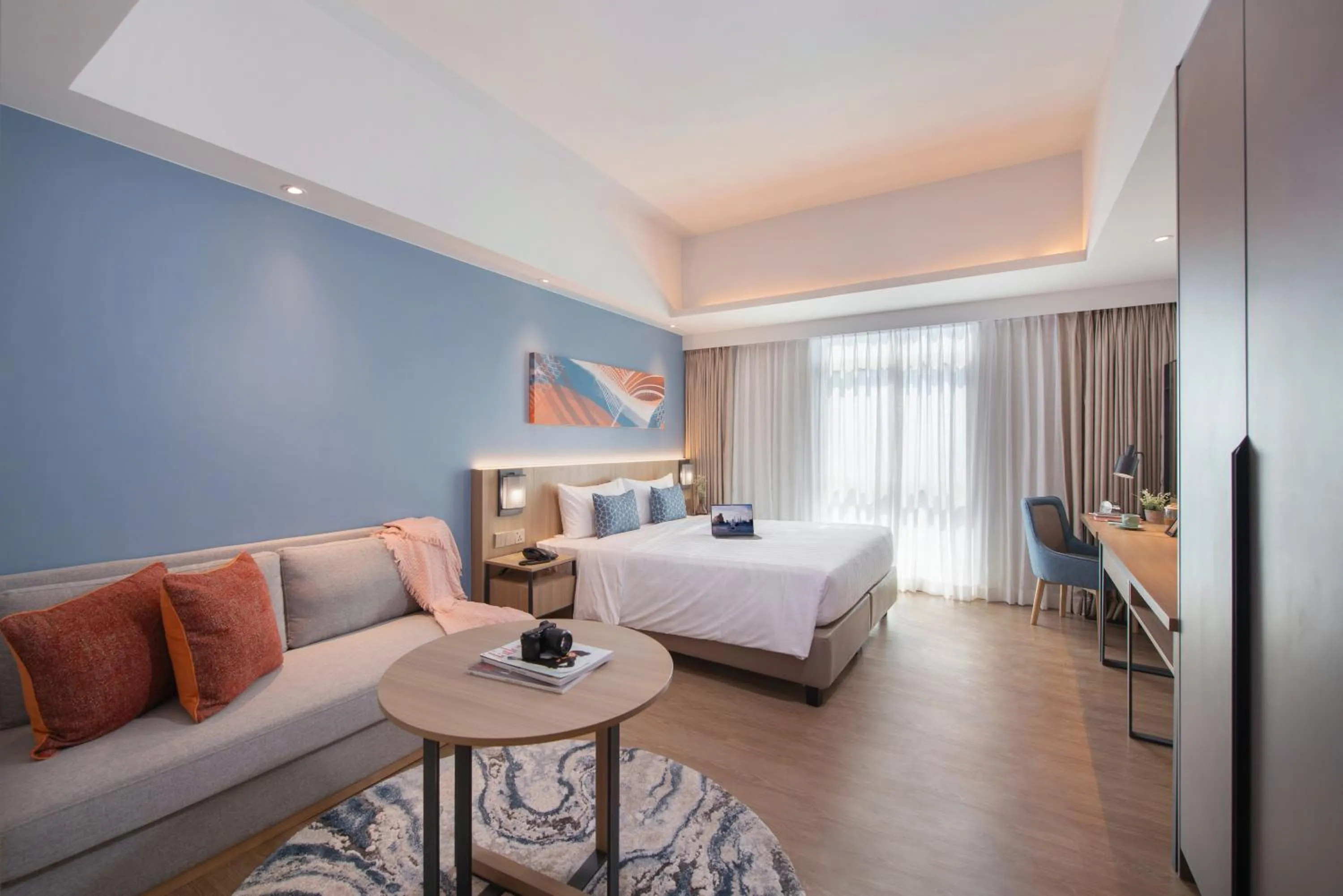 Seating area, Bed in Citadines Roces Quezon City