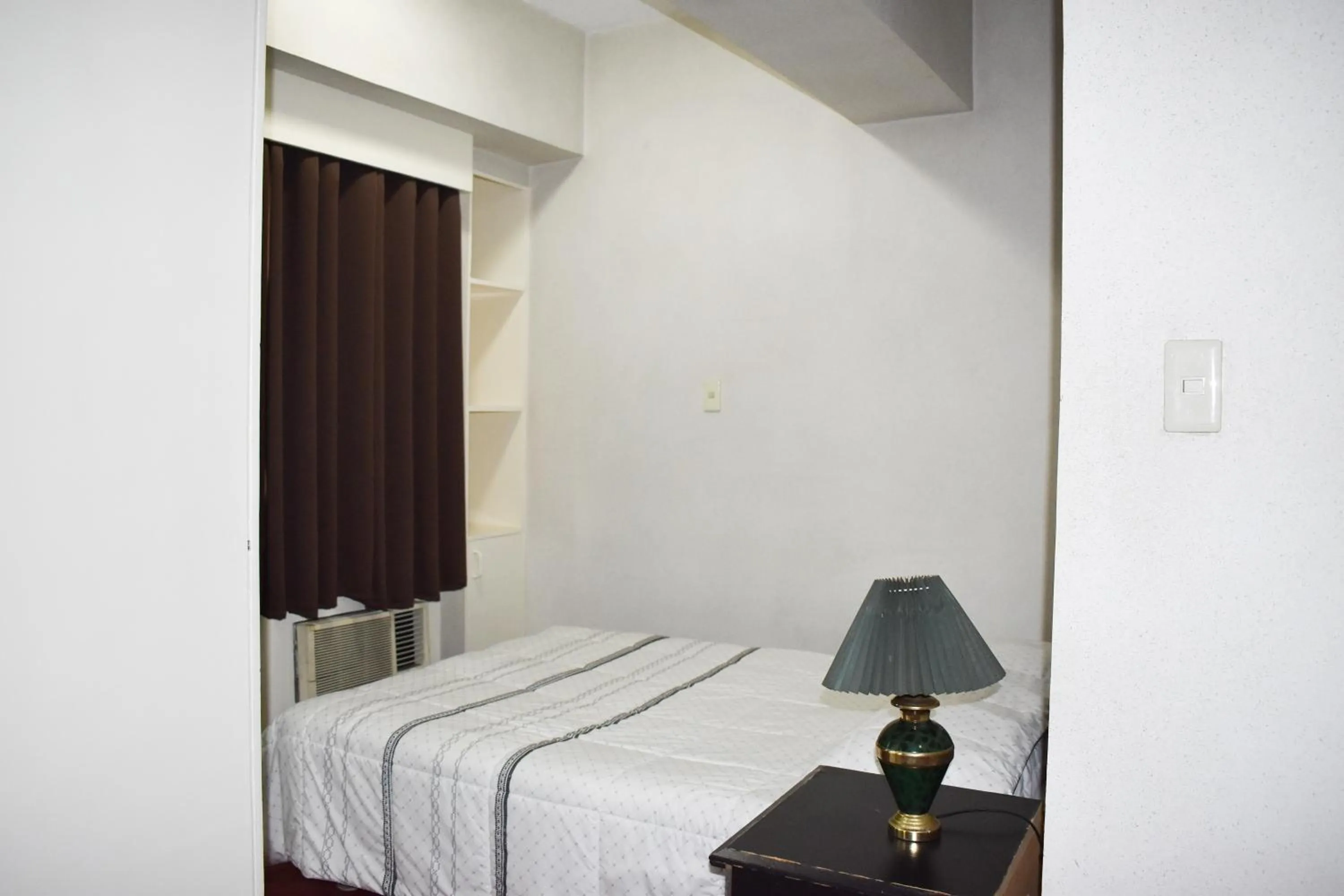 Bed in Sunette Tower Suites Makati