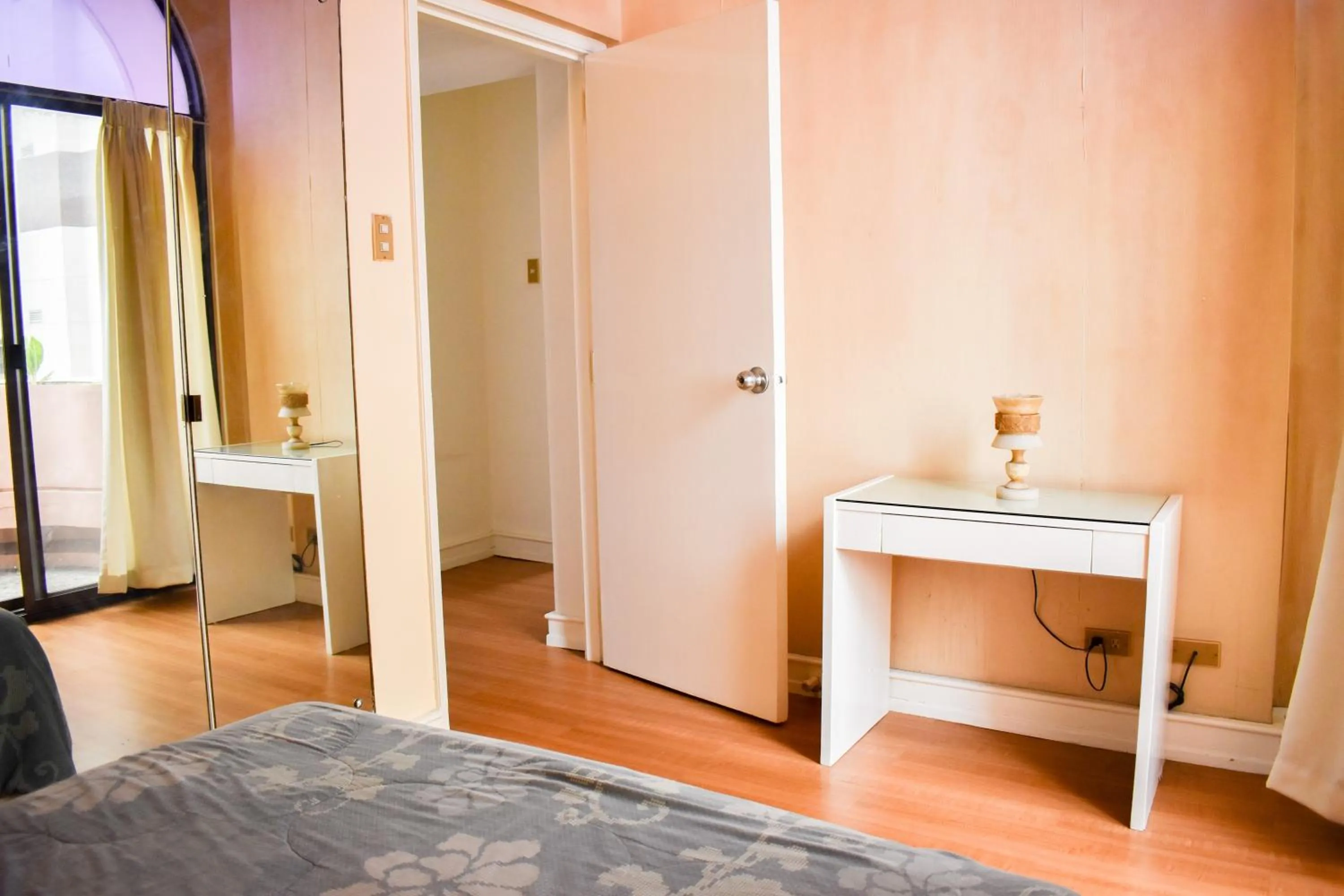 Bed in Sunette Tower Suites Makati