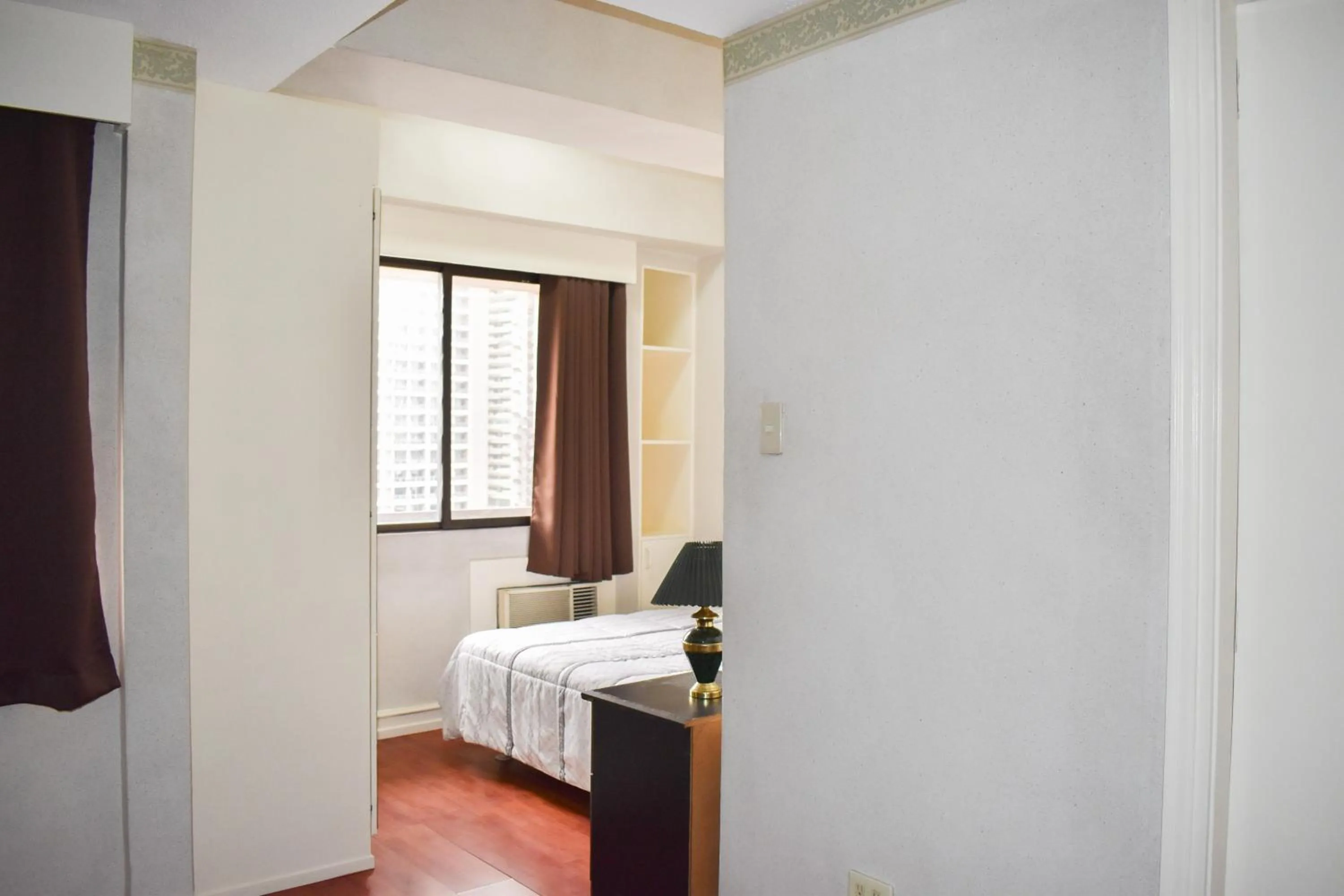 Bed in Sunette Tower Suites Makati