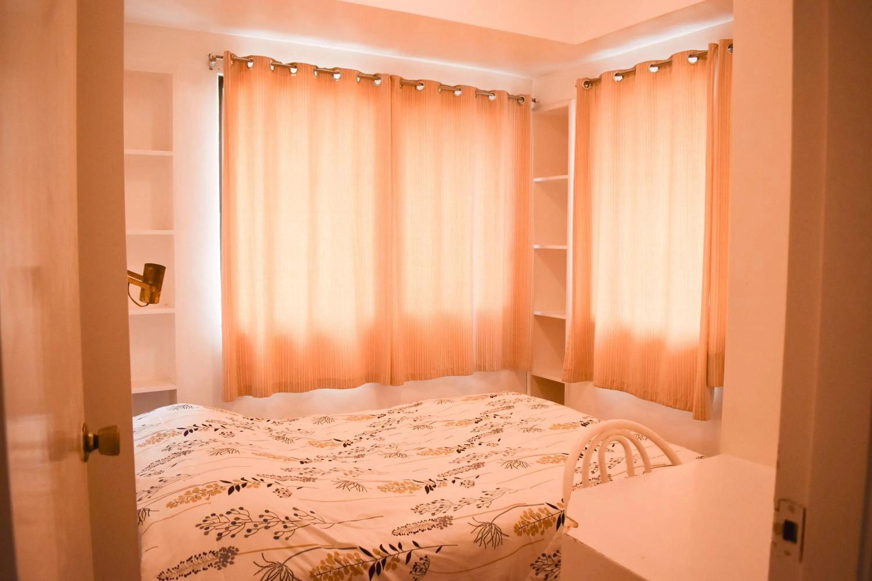 Bed in Sunette Tower Suites Makati