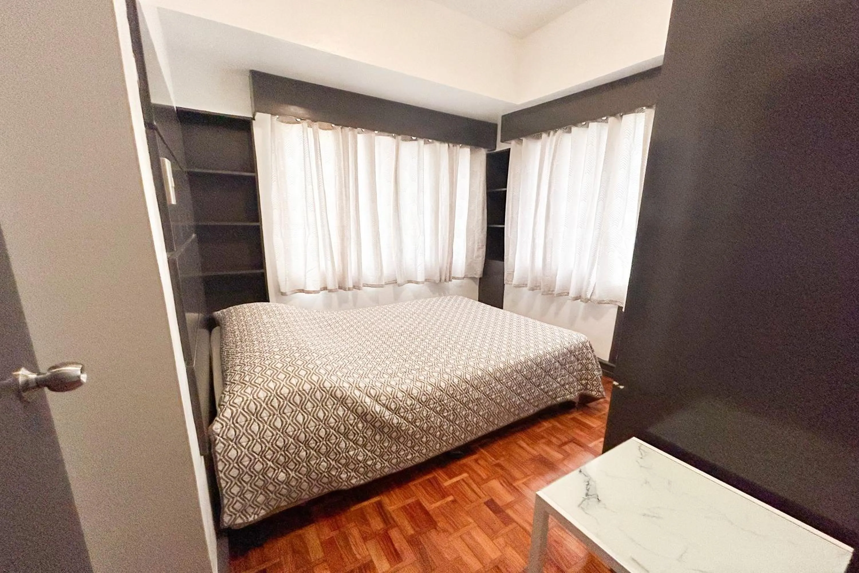 Bed in Sunette Tower Suites Makati