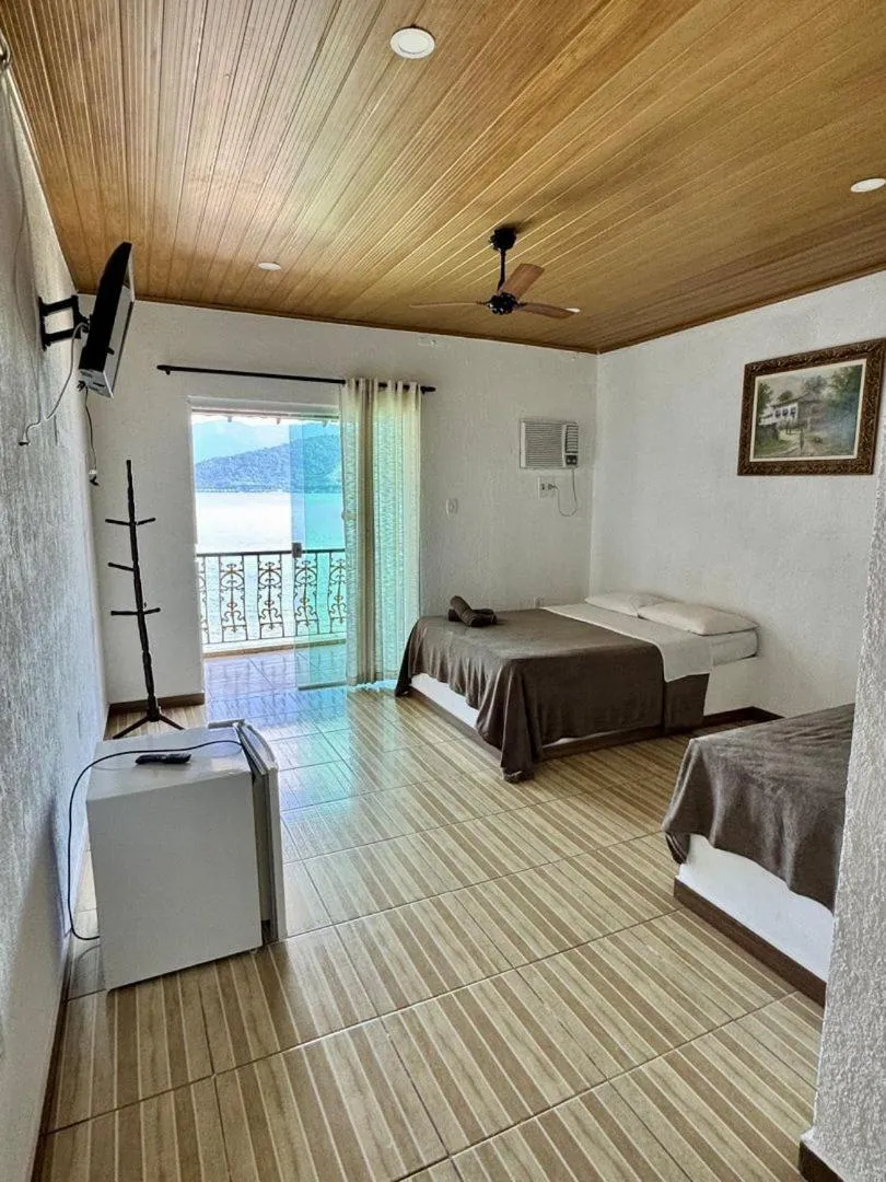 Bed in Pousada da Praia