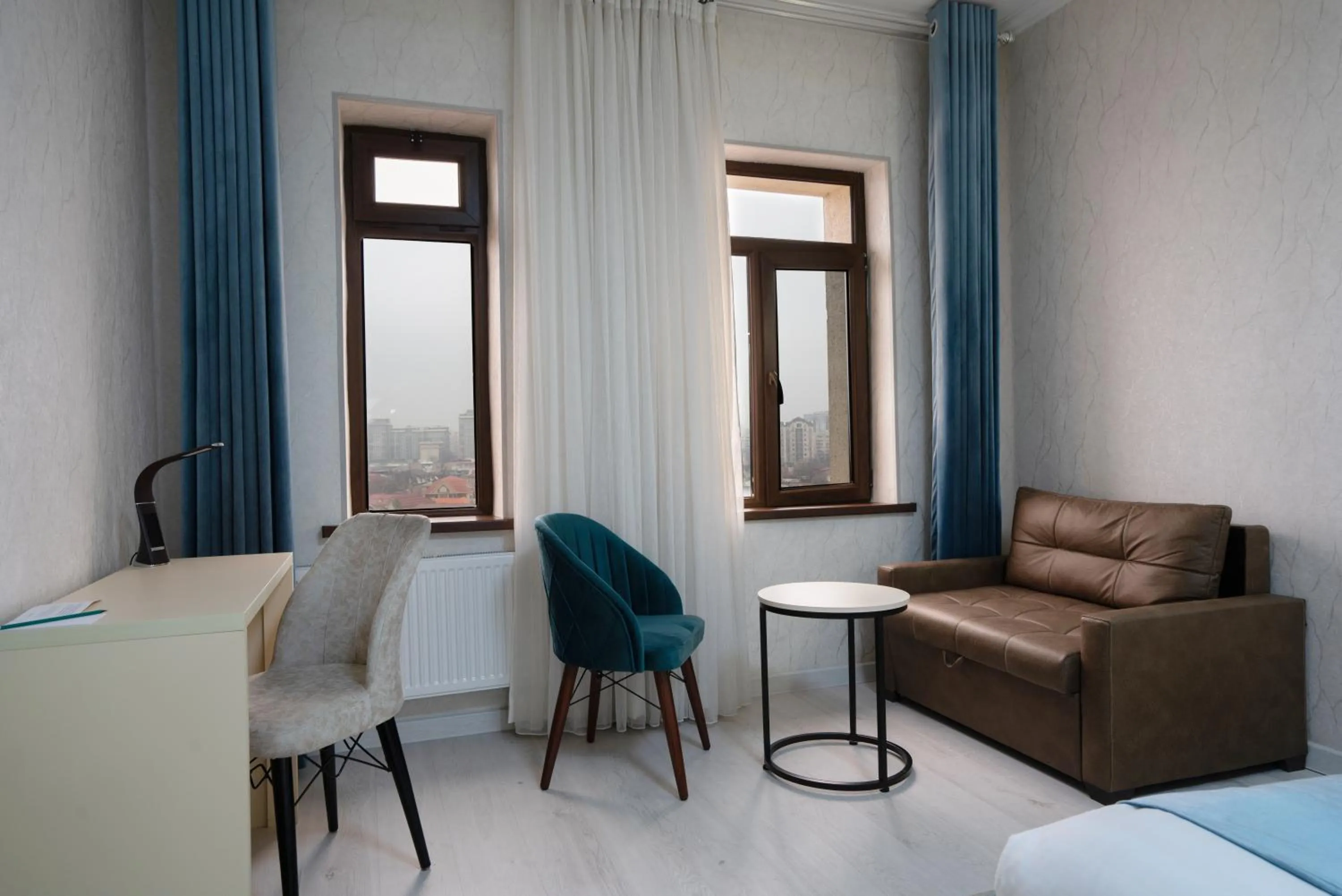 Seating area, Bed in The Tower Hotel Tashkent by HotelPro Group