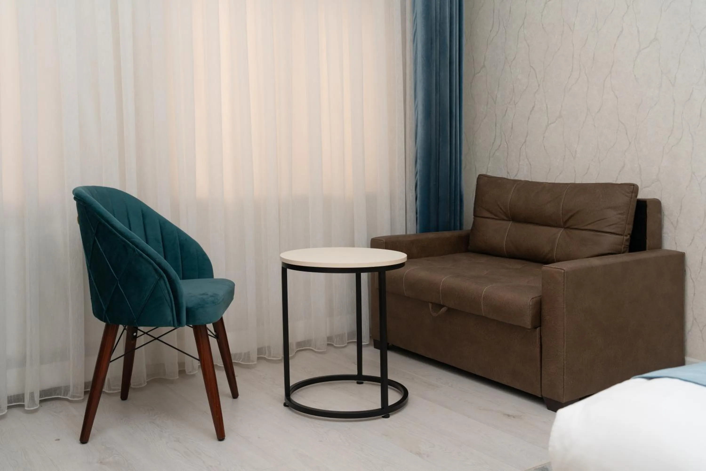 Seating area in The Tower Hotel Tashkent by HotelPro Group