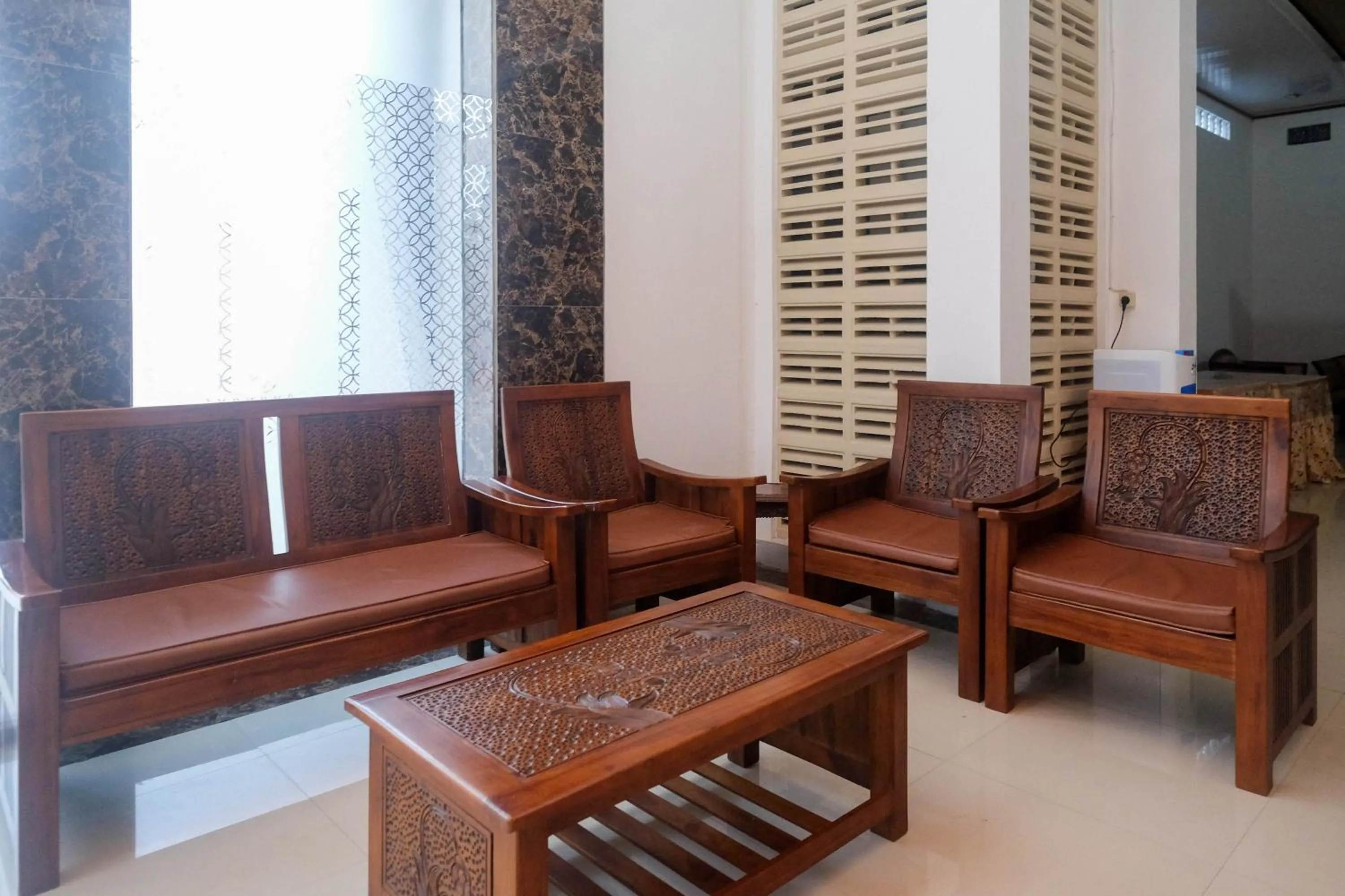 Seating area in RedDoorz Syariah near Alun Alun Temanggung