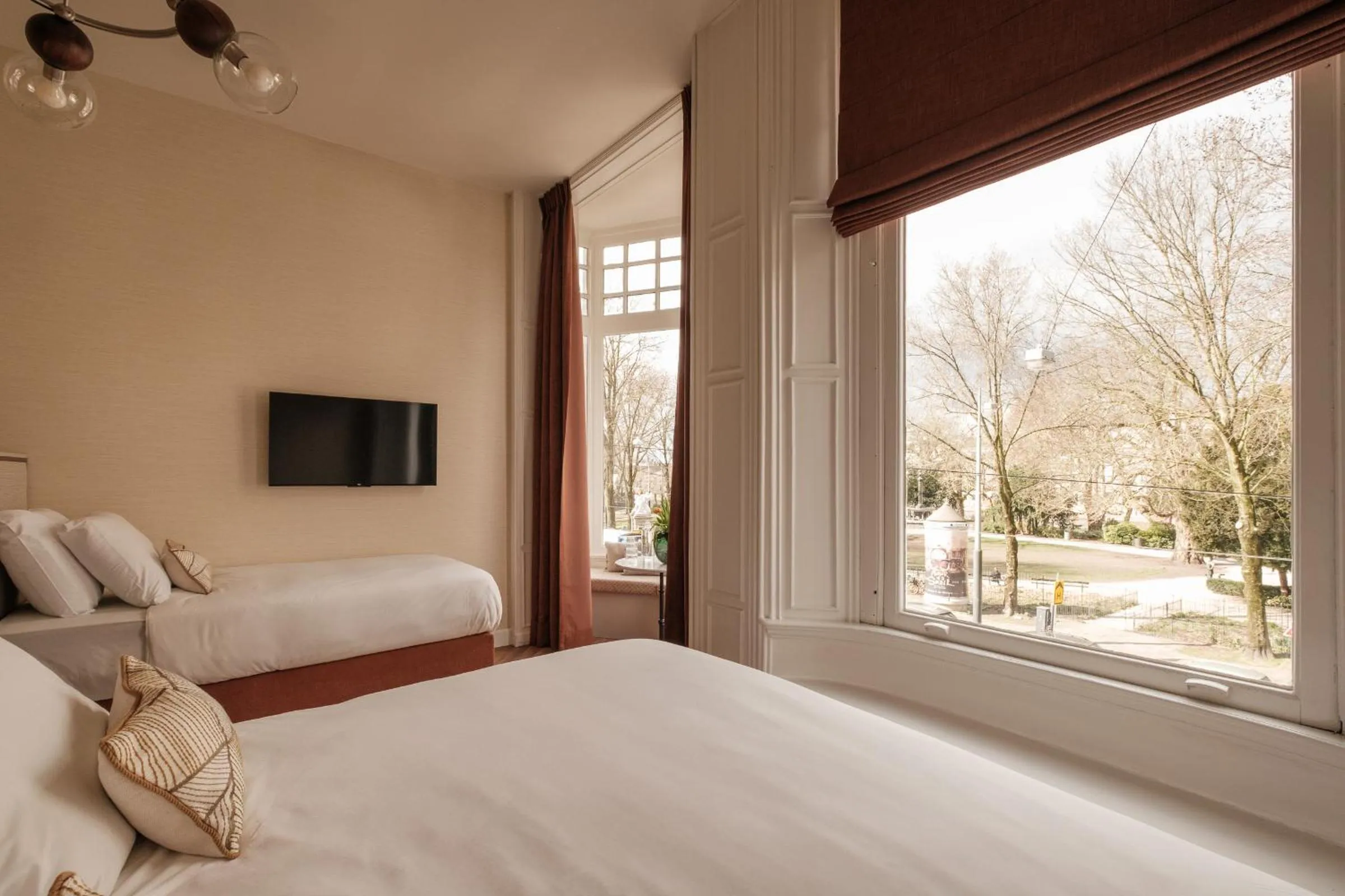 Bed in Parklane Hotel