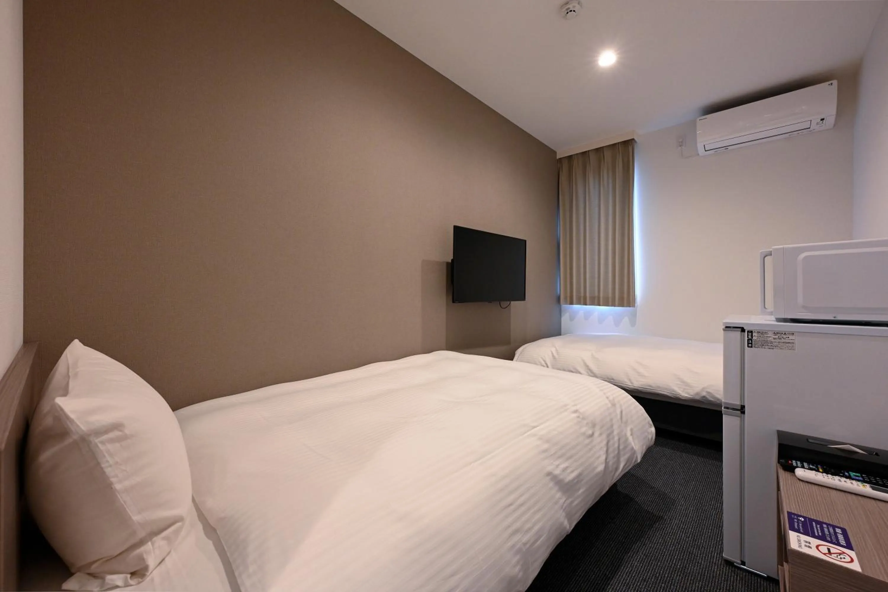 Photo of the whole room, Bed in HOTEL R9 The Yard Satsumasendai