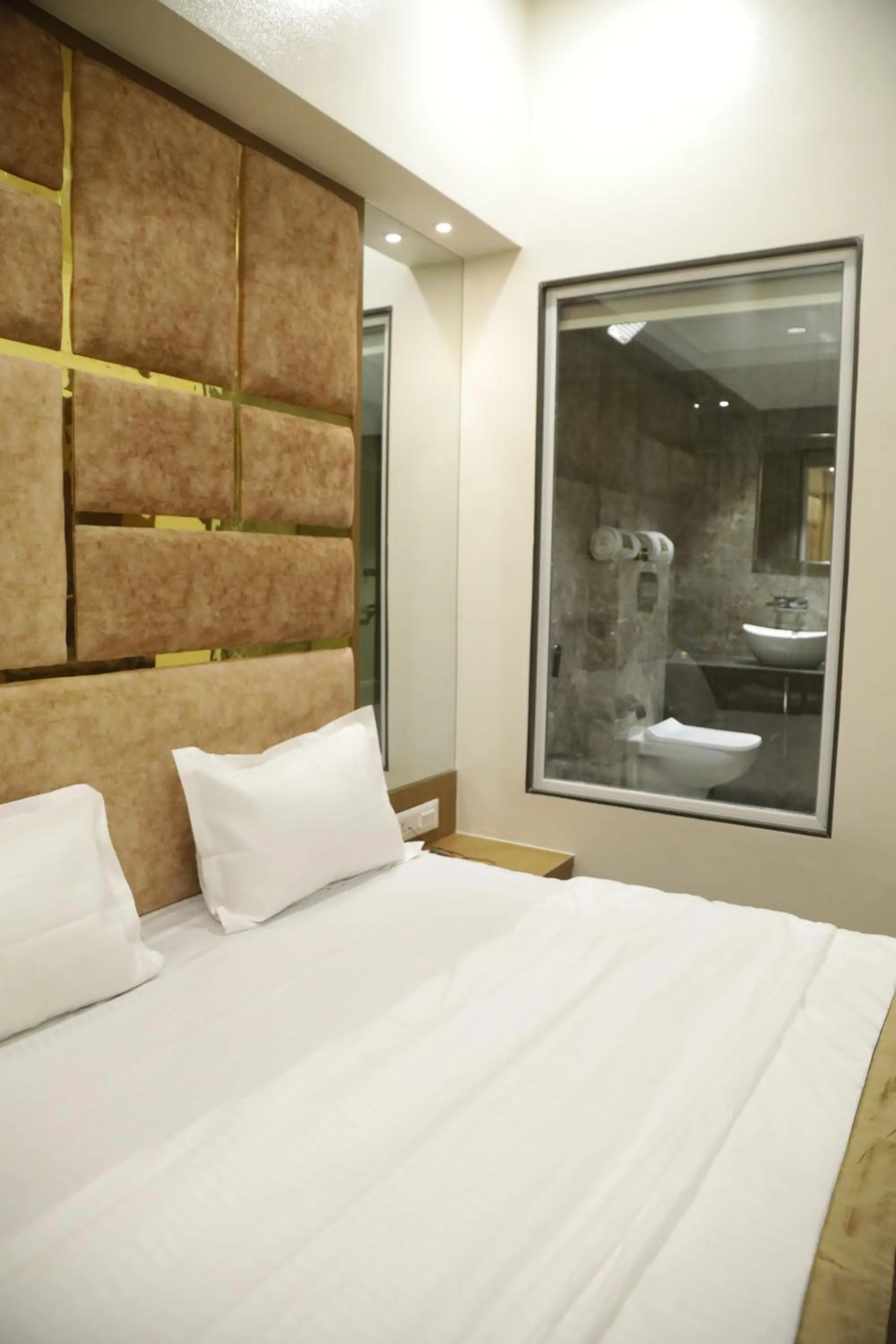 Bed in Hotel M Residency