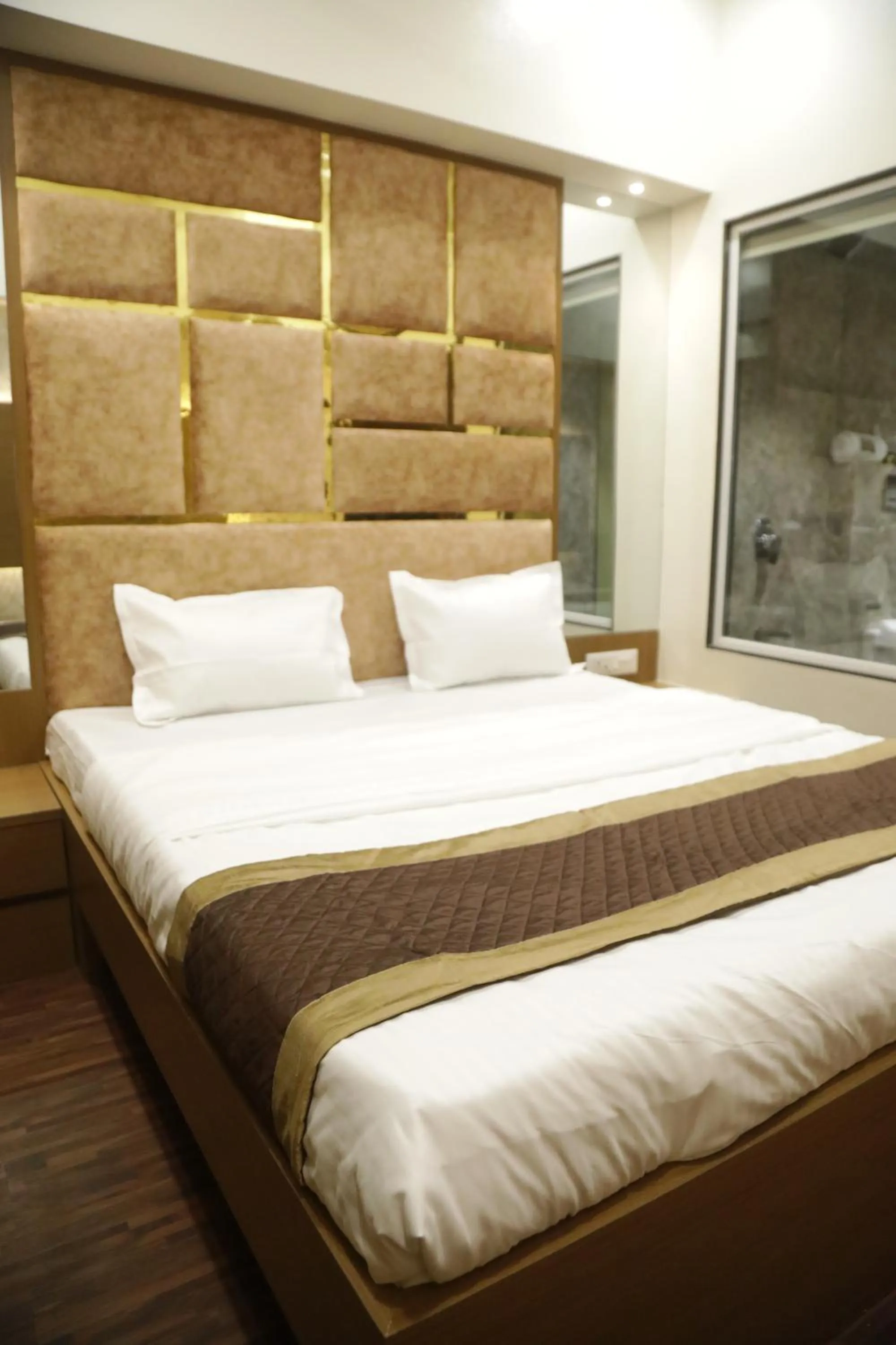 Bed in Hotel M Residency