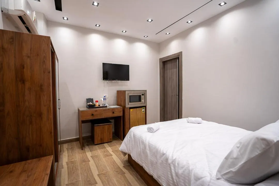 Bed in Sun and Sand Guest House